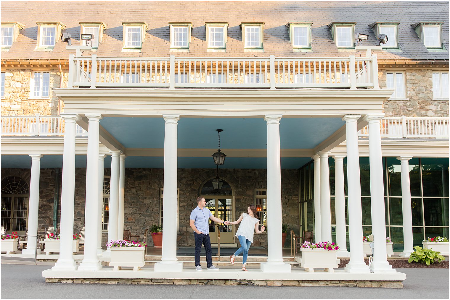 engaged could holds hands standing on landing at Skytop Lodge