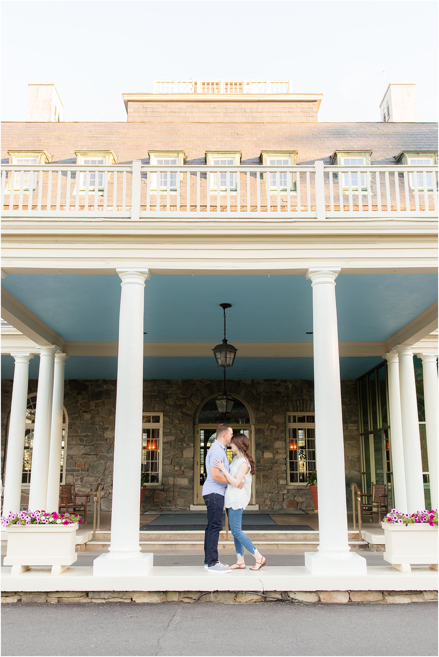 bride and groom pose on steps at Skytop Lodge