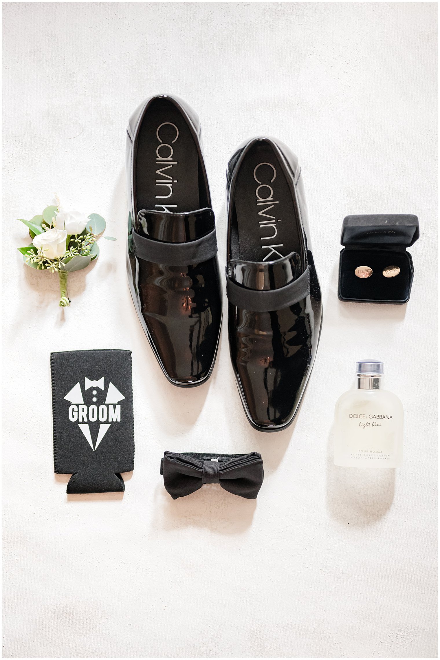 groom's Calvin Klein shoes and classic details