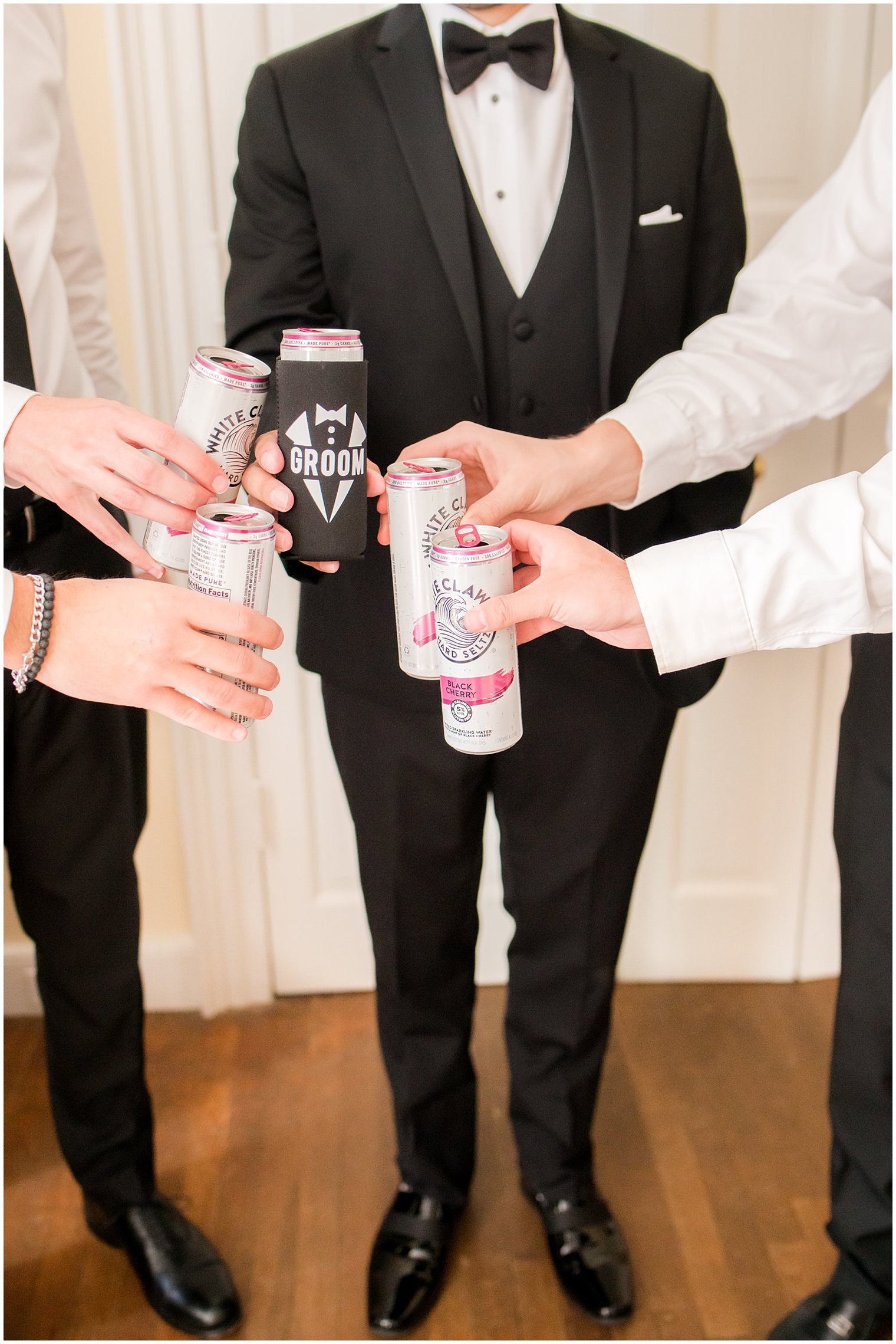 groom and groomsmen toast White Claws before NJ wedding