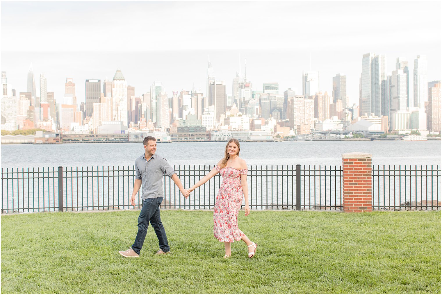 bride and groom hold hands walking through park in Weehawken NJ