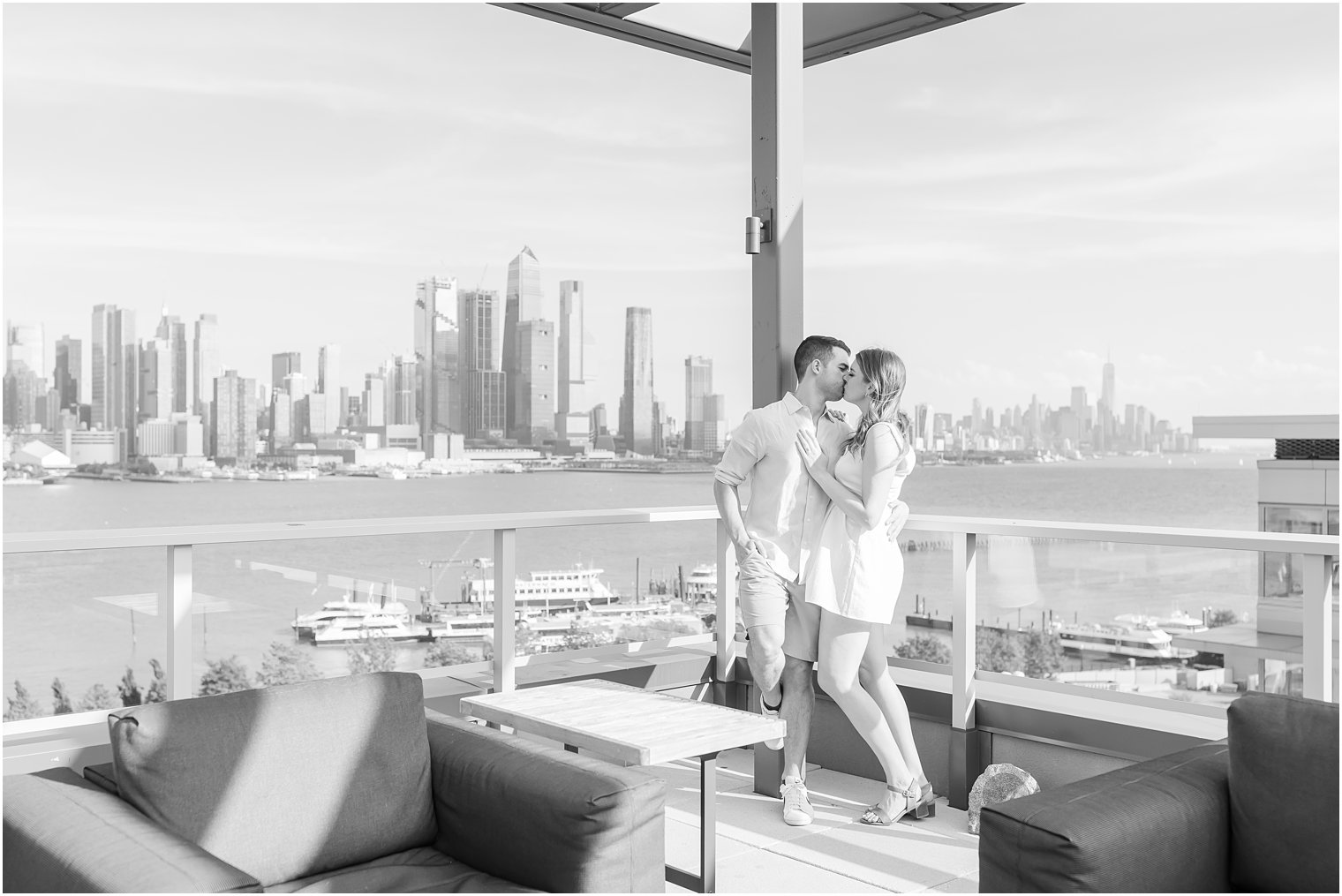 bride and groom kiss on rooftop bar in Weehawken NJ