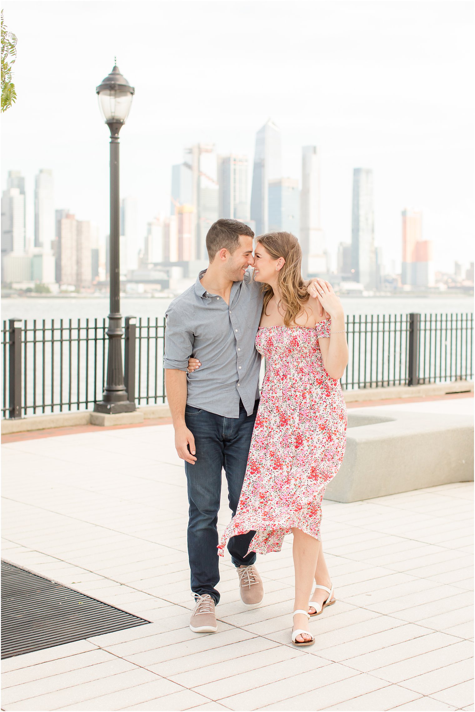 engaged couple hugs during Weehawken waterfront engagement session 