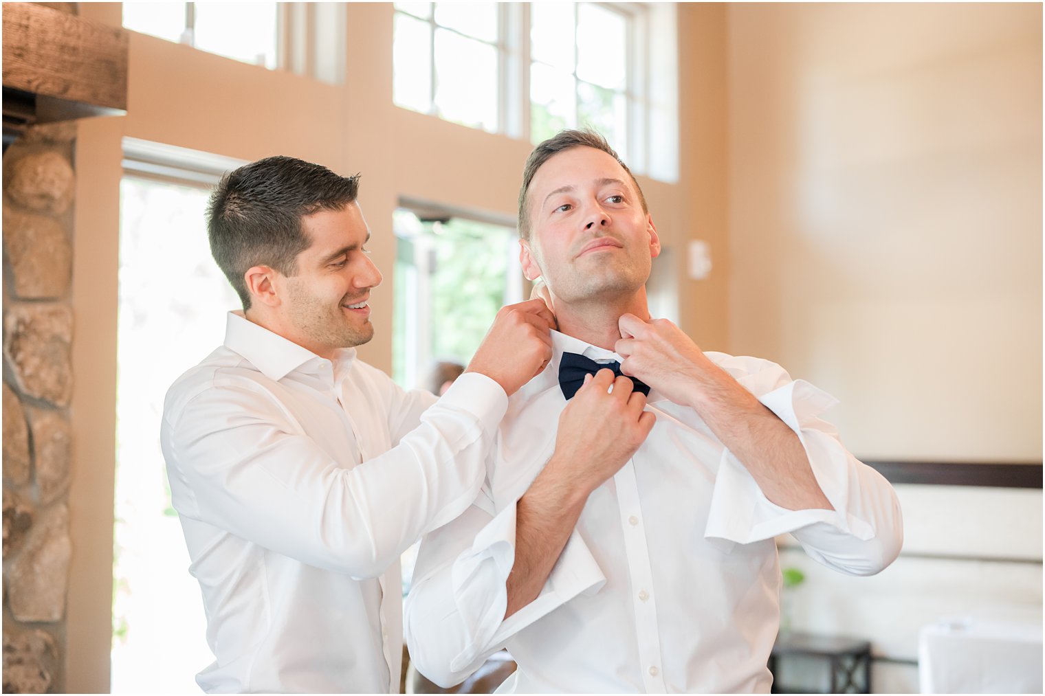 groomsman helps groom prepare for Indian Trail Club wedding 