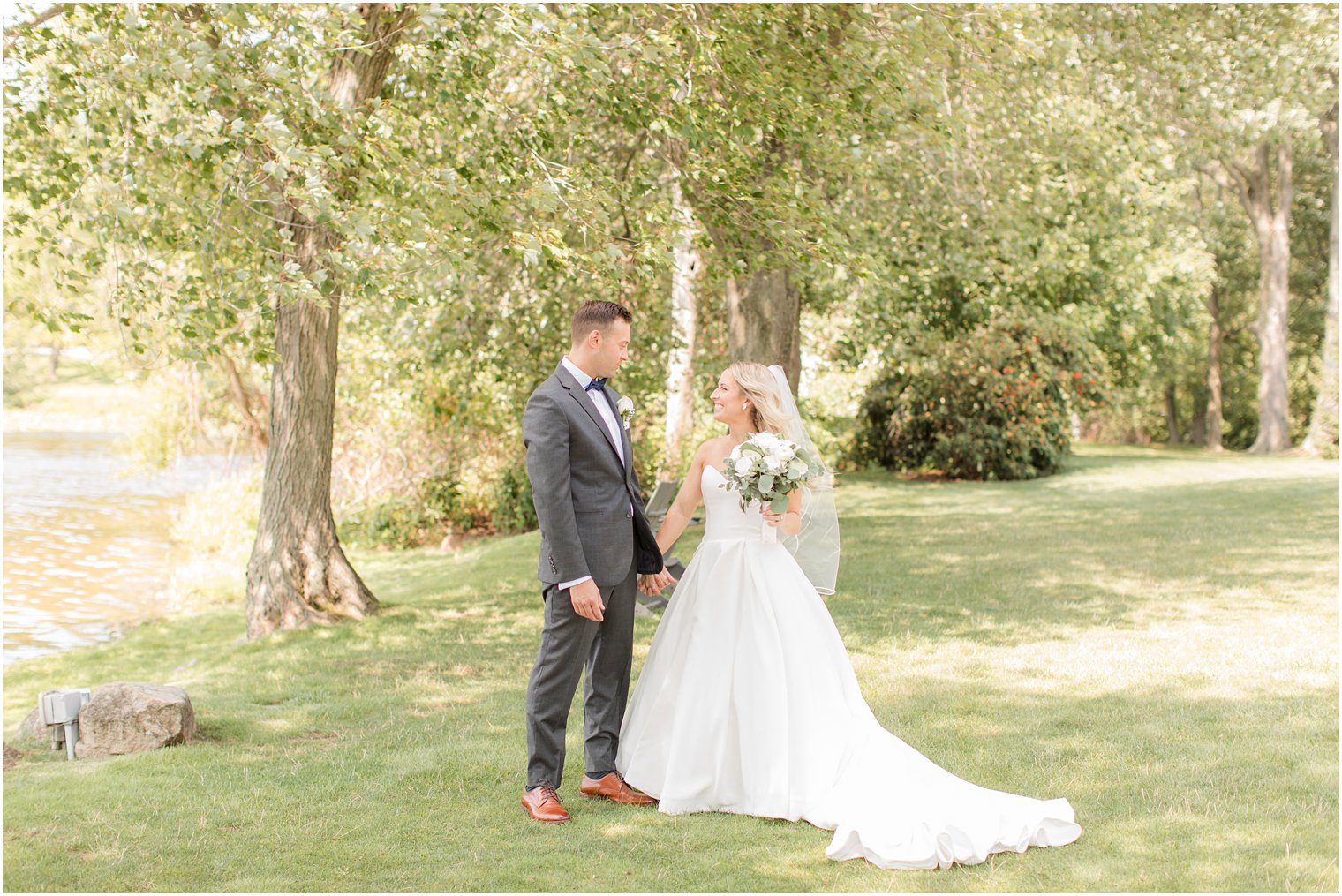 bride and groom hold hands at Indian Trail Club