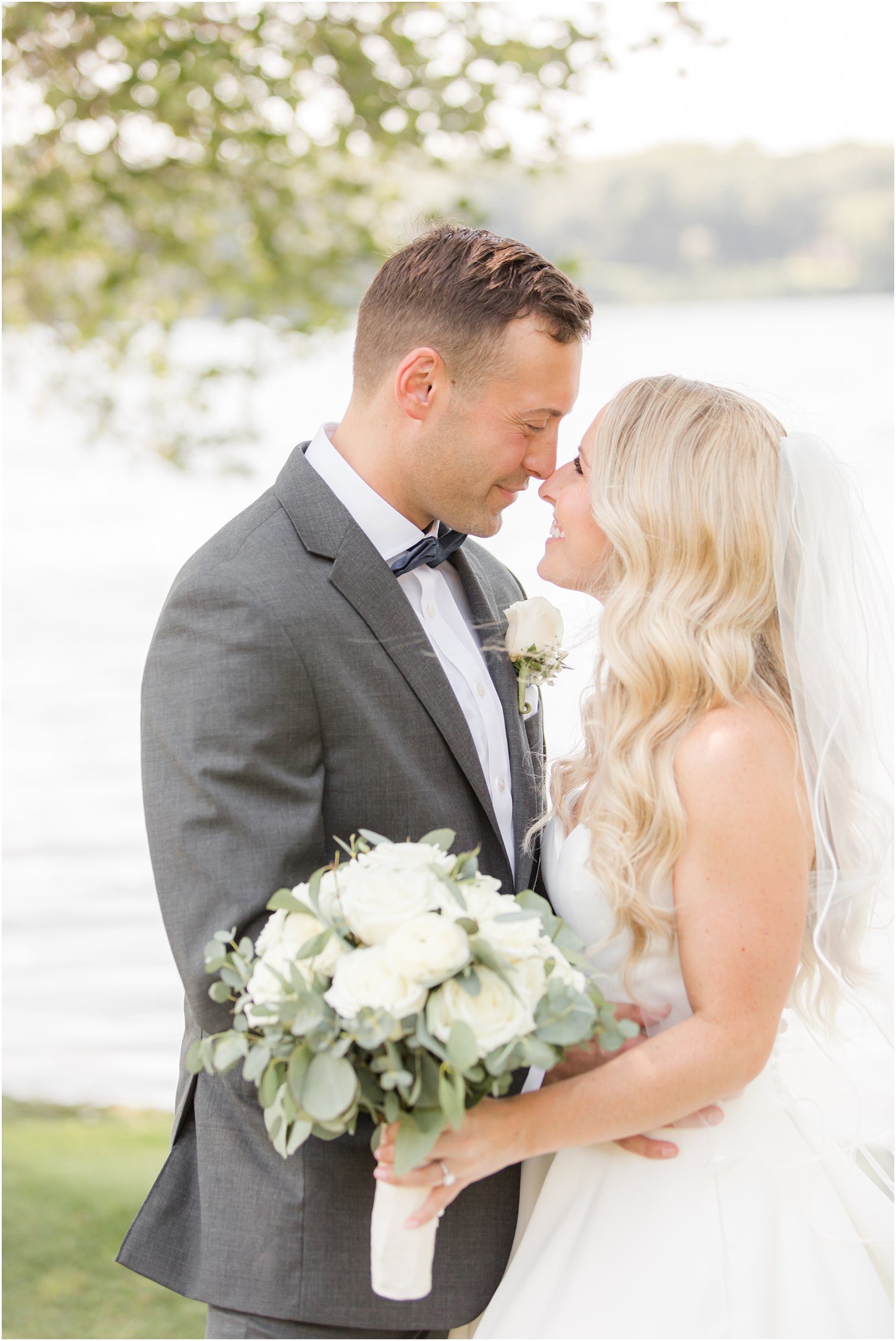 bride and groom hug during Indian Trail Club wedding portraits