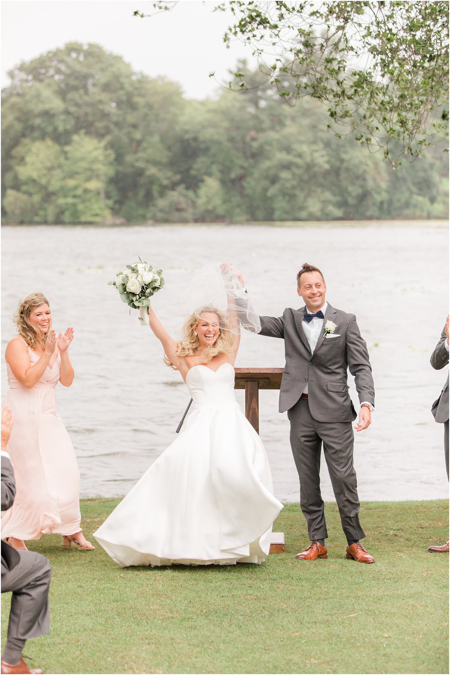 bride and groom cheer after outdoor wedding ceremony in Franklin Lakes