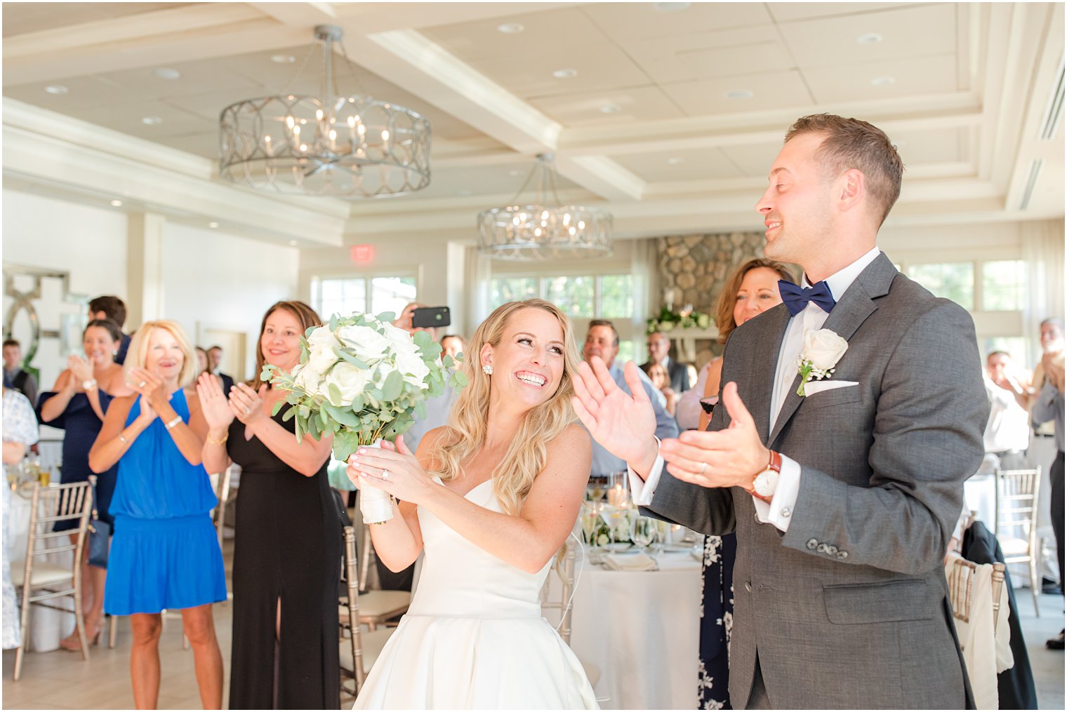 bride and groom clap together during New Jersey wedding reception