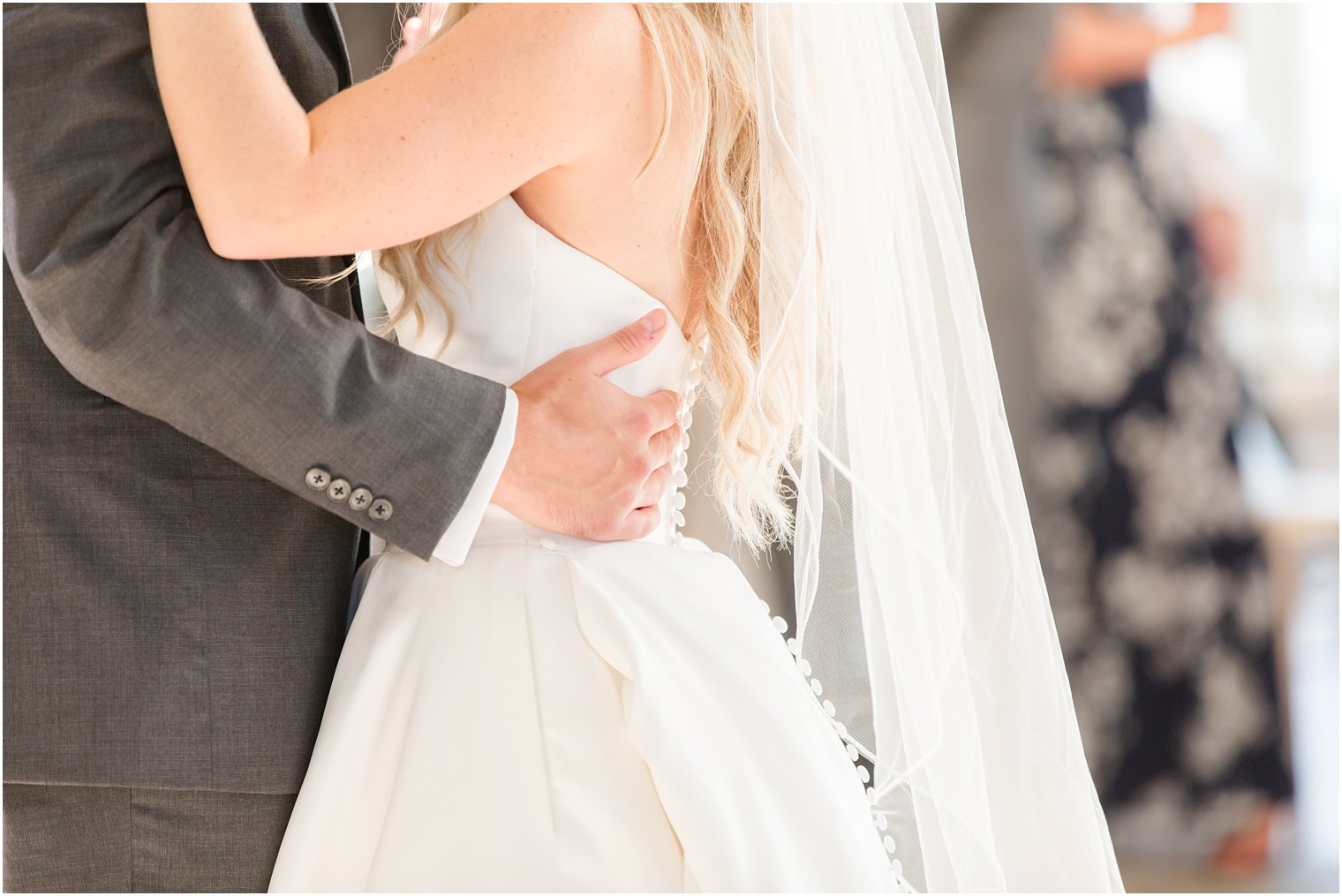 groom hugs bride during first dance at New Jersey wedding reception
