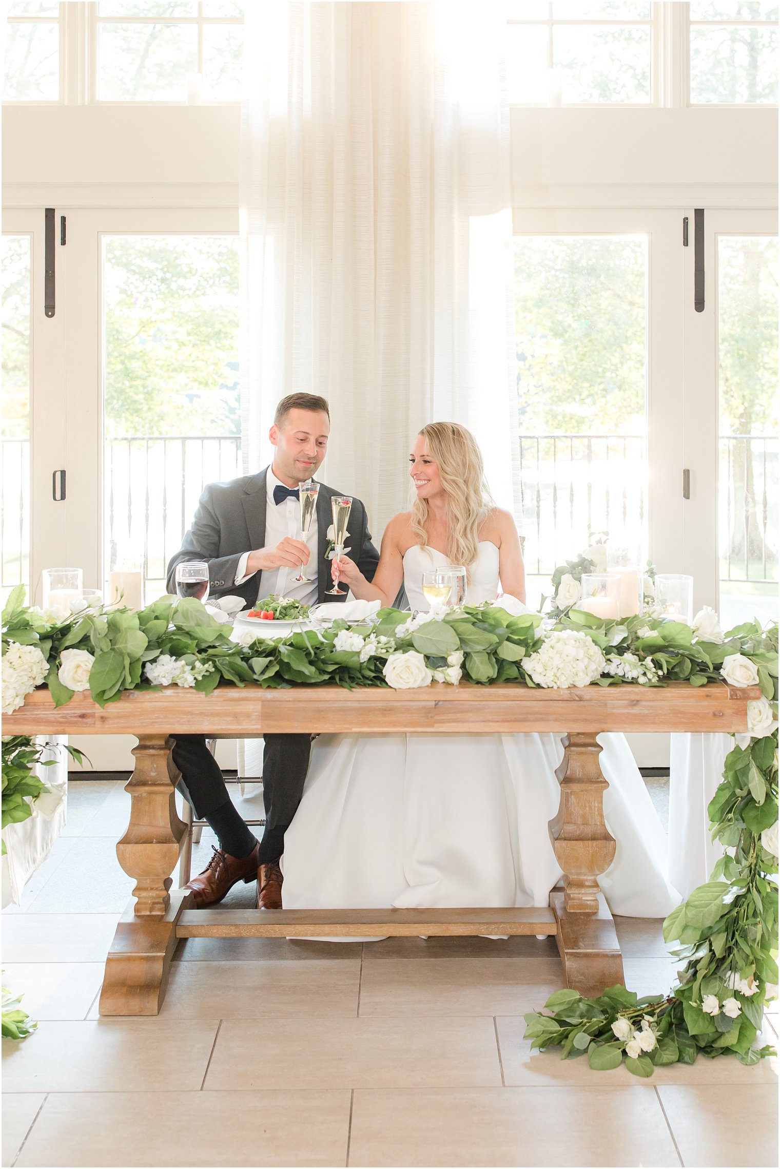 newlyweds toast champagne during New Jersey wedding reception