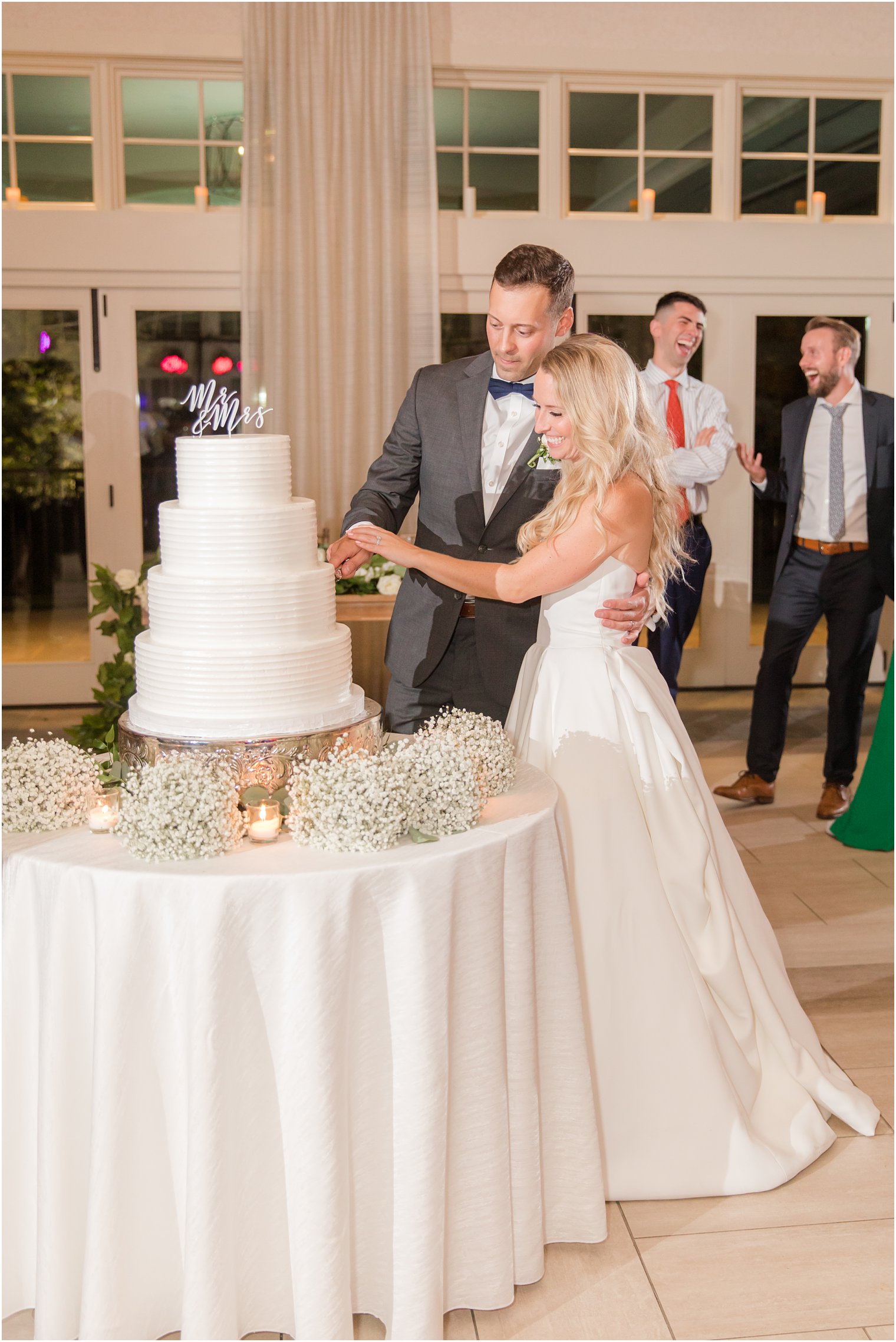 newlyweds cut wedding cake at New Jersey wedding reception