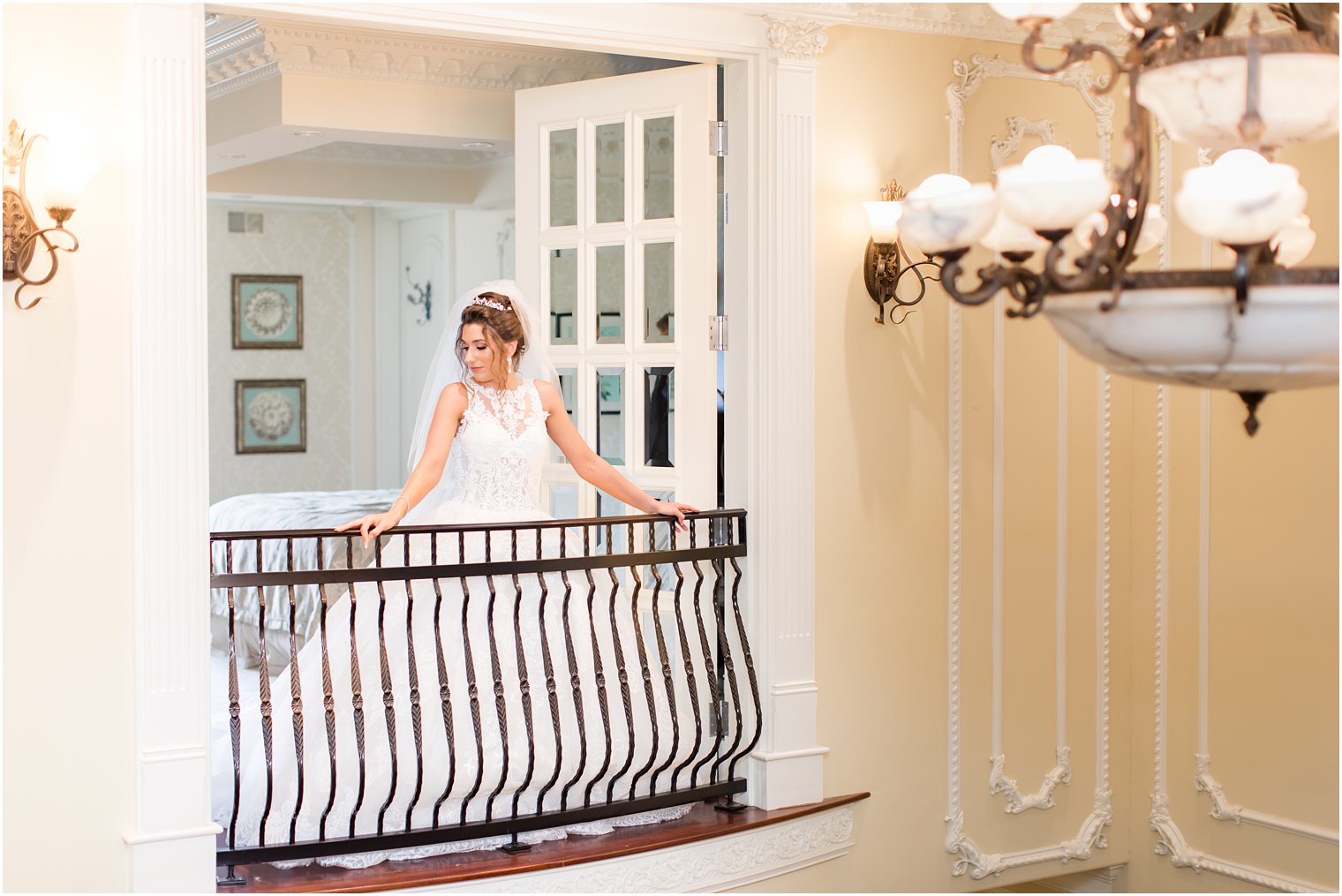 bride poses on balcony of bridal suite at the Ashford Estate