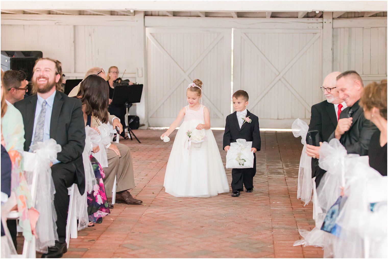 flower girl and ring bearer walk down aisle for NJ wedding ceremony 