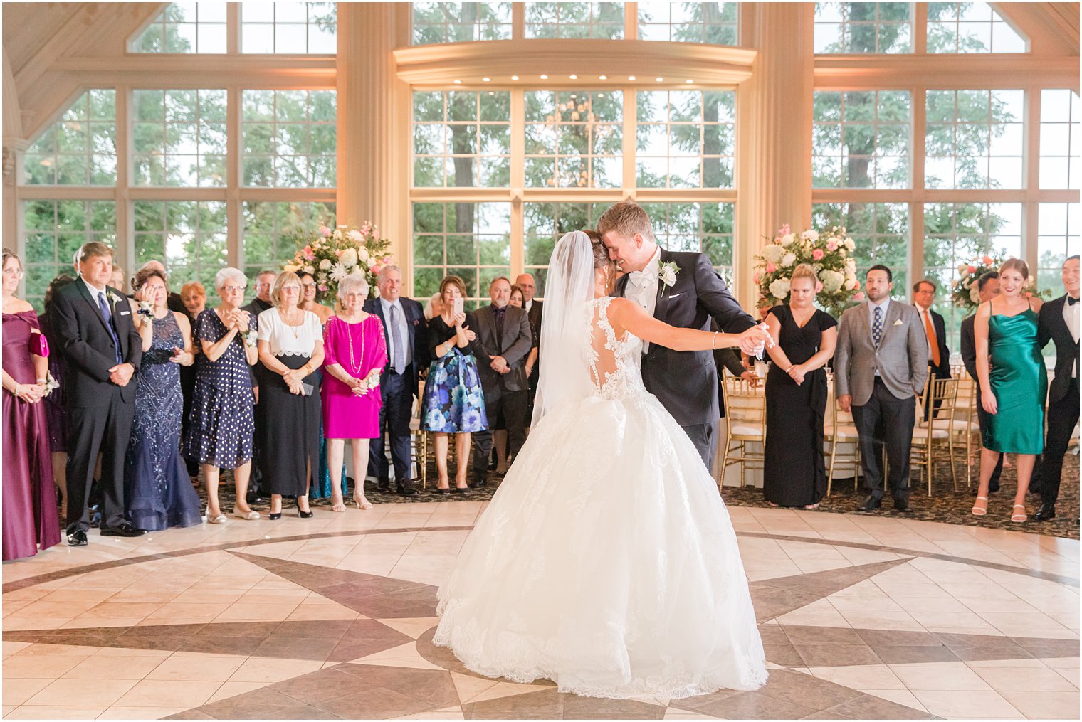 newlyweds have first dance at Ashford Estate with guests around them