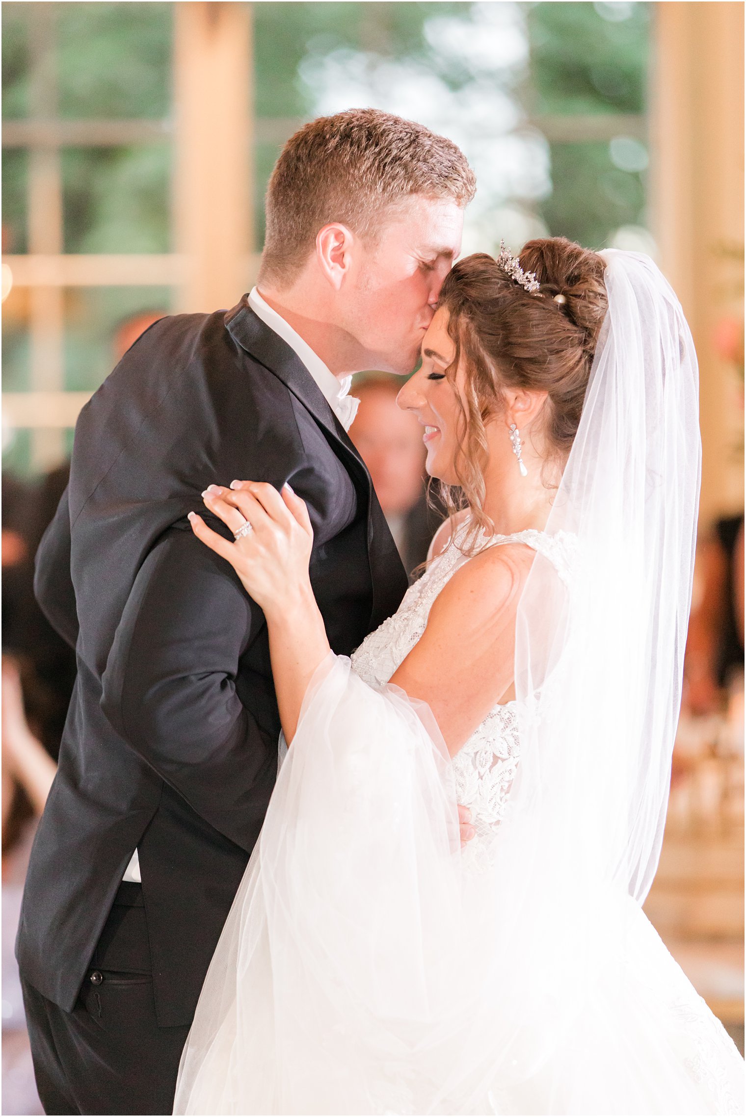 groom kisses wife during dance at Allentown NJ wedding reception
