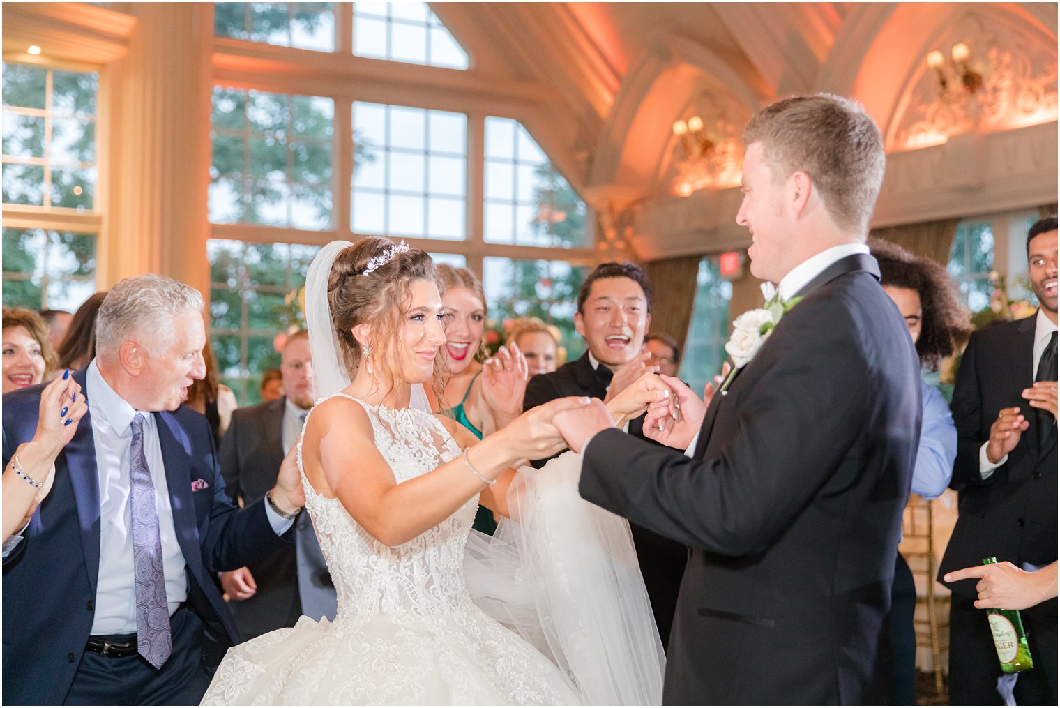 bride and groom dance during Allentown NJ wedding reception with guests
