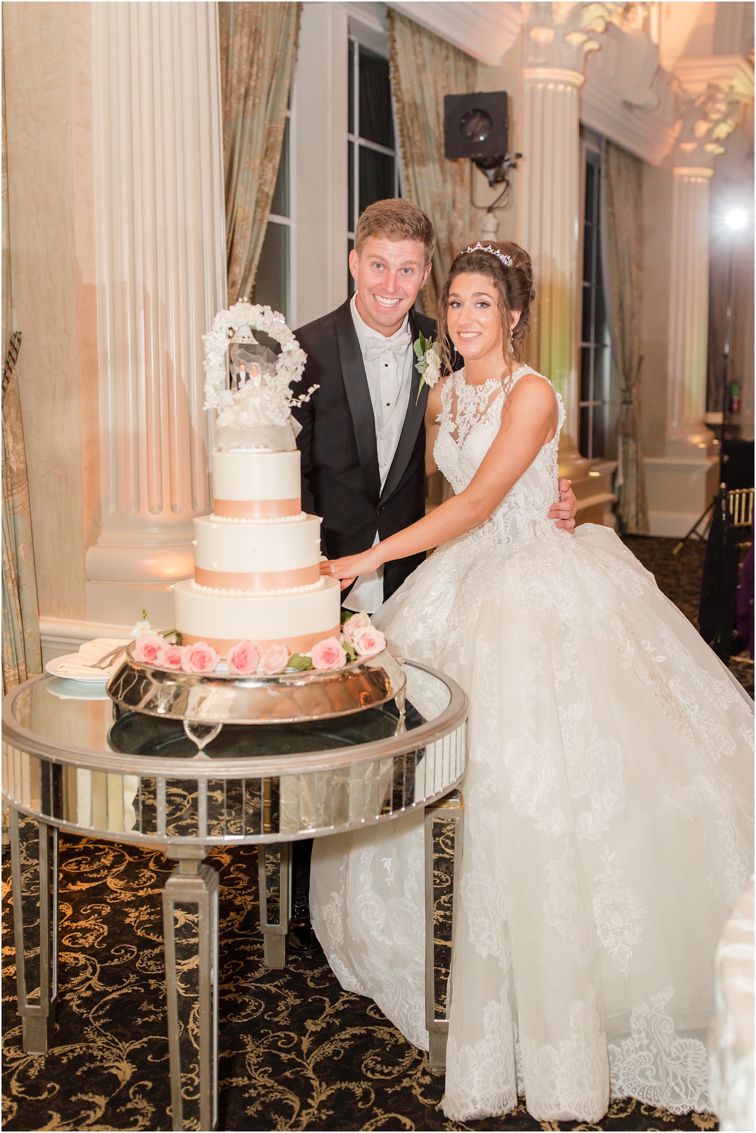 bride and groom cut wedding cake during Allentown NJ wedding reception