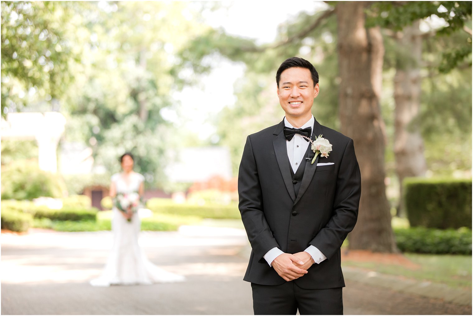 bride approaches groom for first look on wedding day