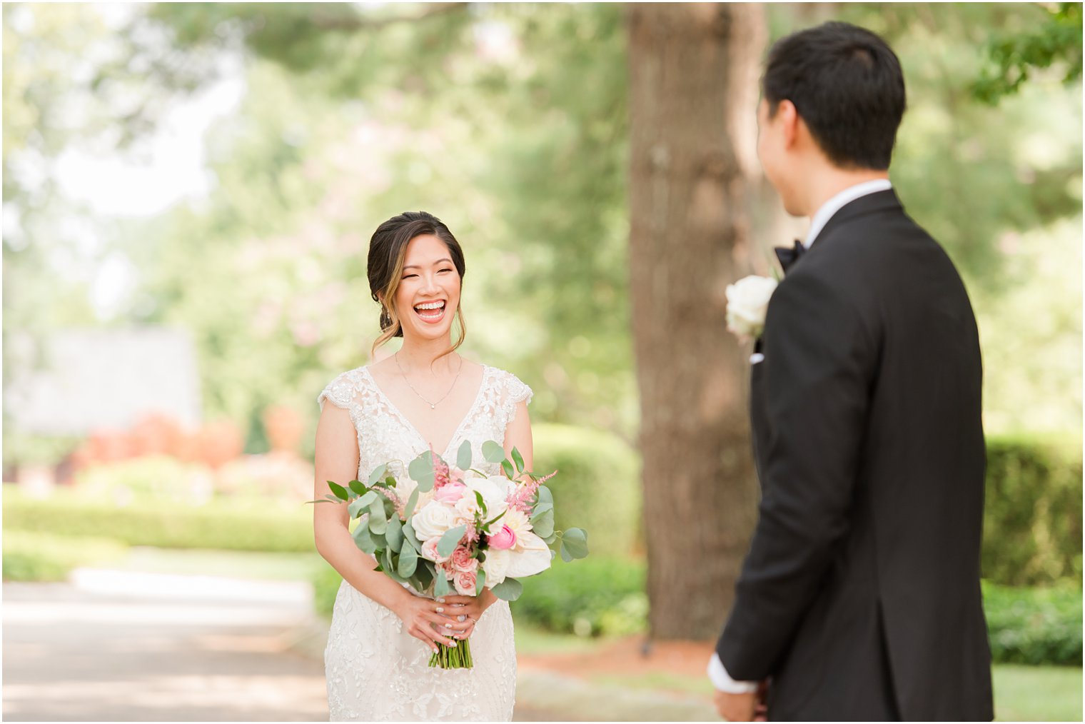 bride smiles at groom during first look at Ashford Estate