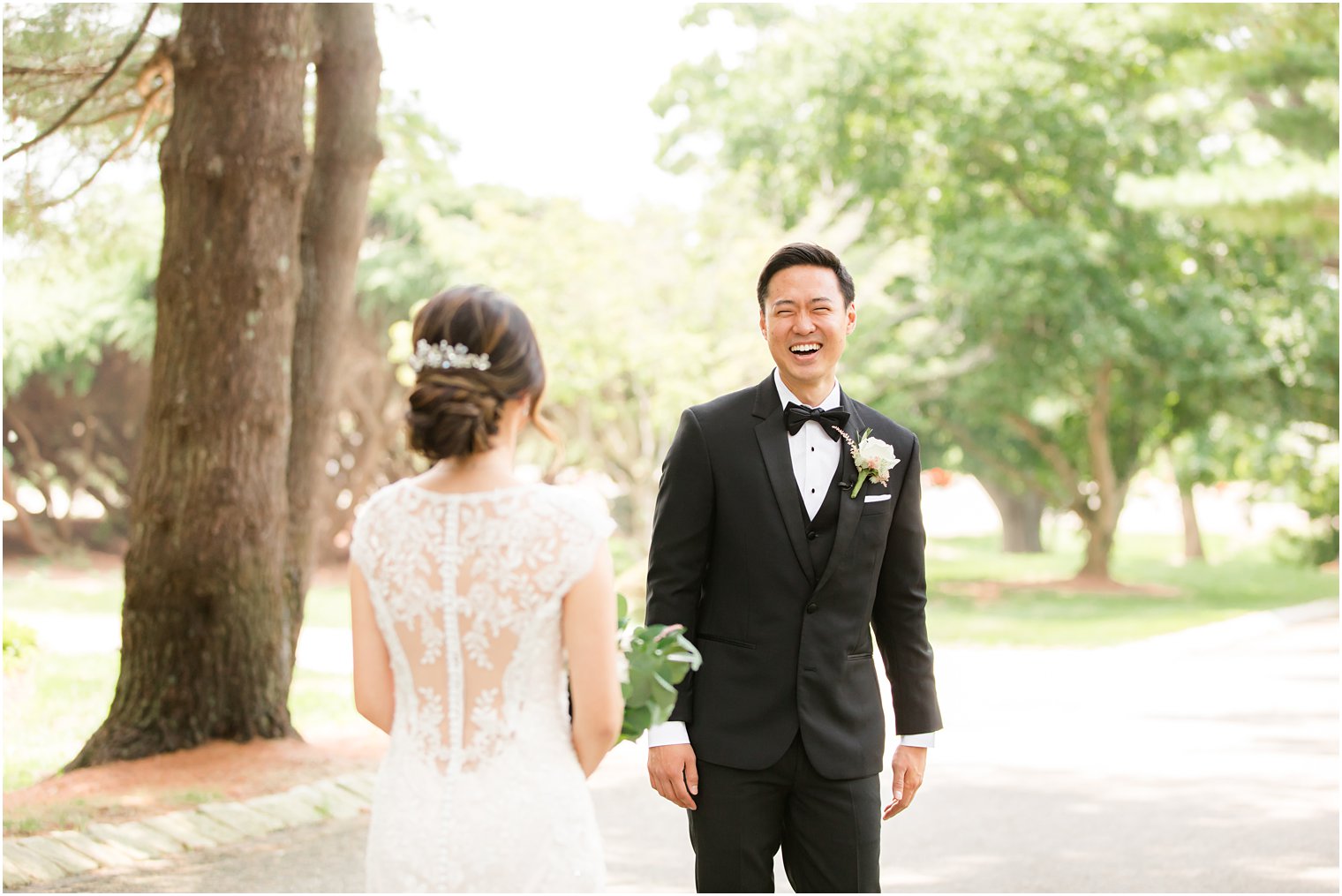 groom smiles and laughs seeing bride for the first time