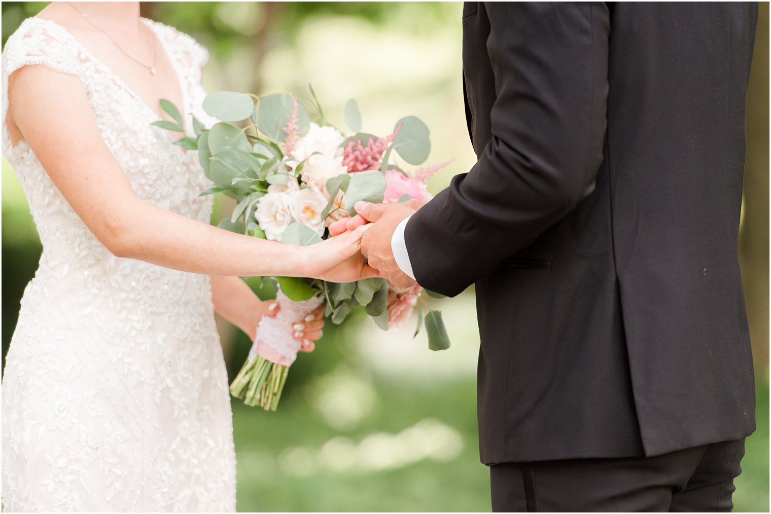 bride and groom hold hands during NJ first look