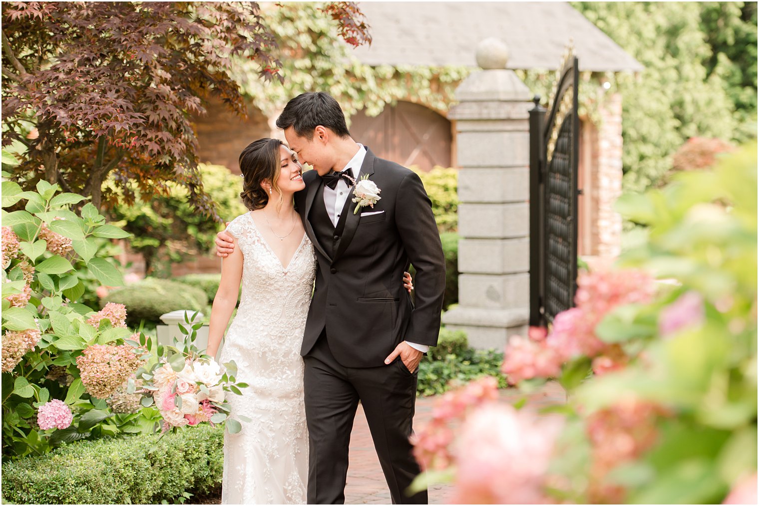 bride and groom hug in gardens of Ashford Estate