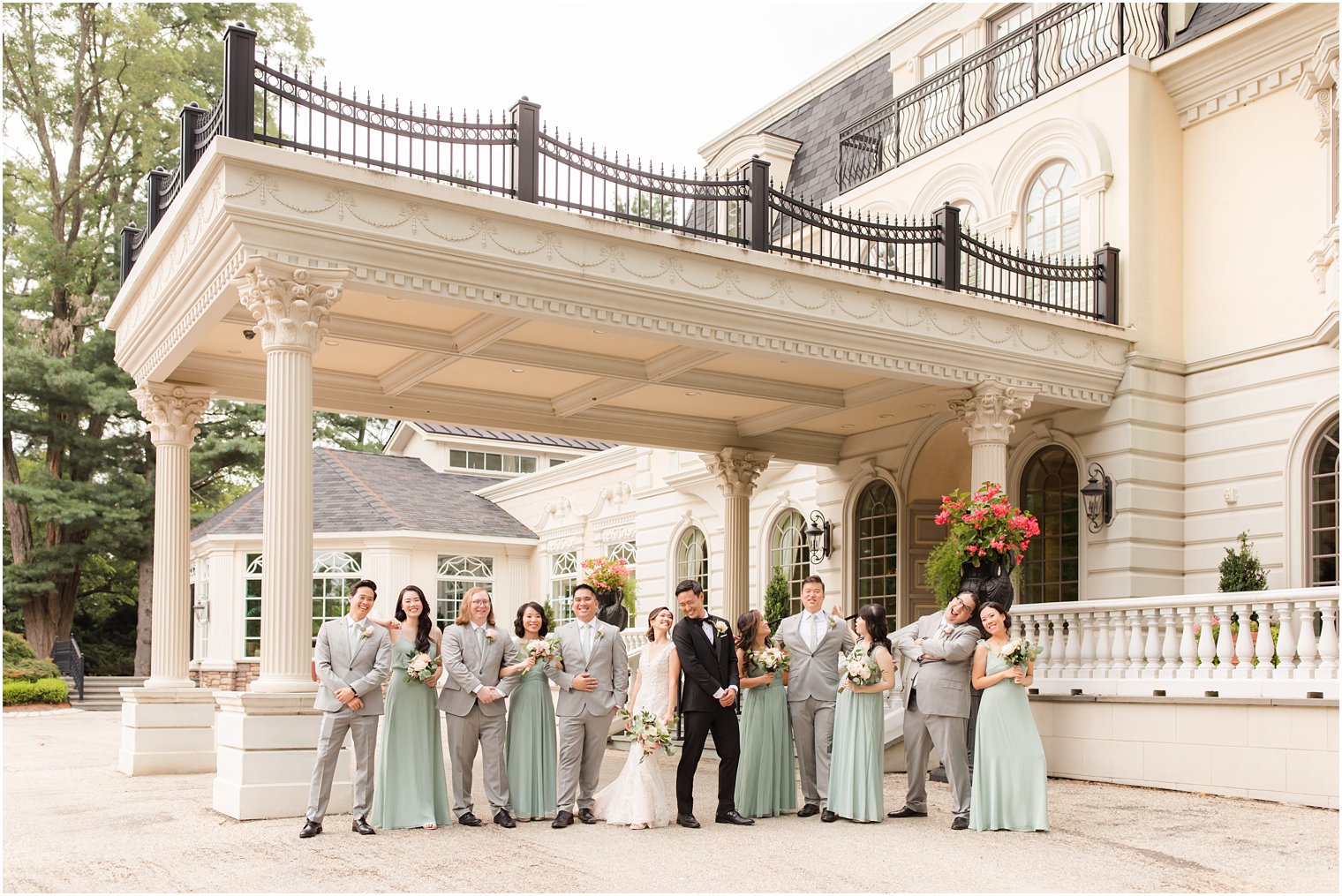 bride and groom pose with bridal party outside Ashford Estate in Allentown NJ