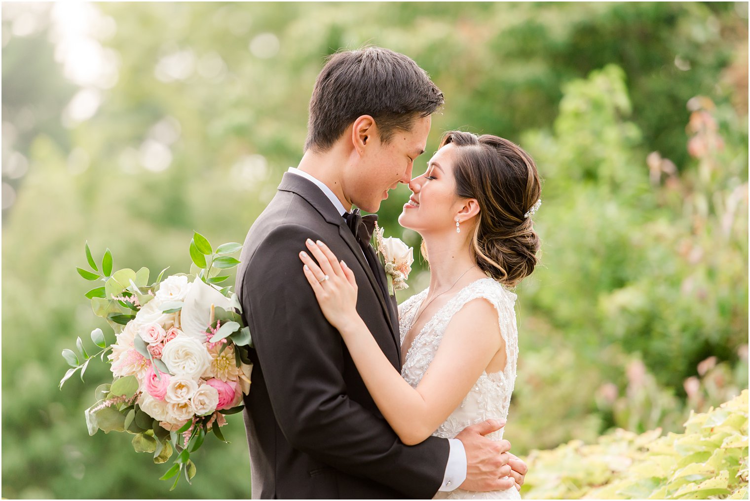 bride and groom stand with noses touching during Ashford Estate wedding portraits 