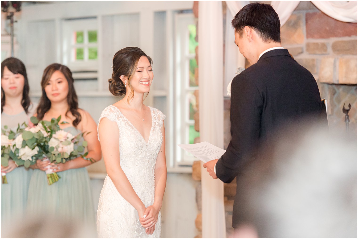 bride laughs during vows for NJ wedding ceremony 