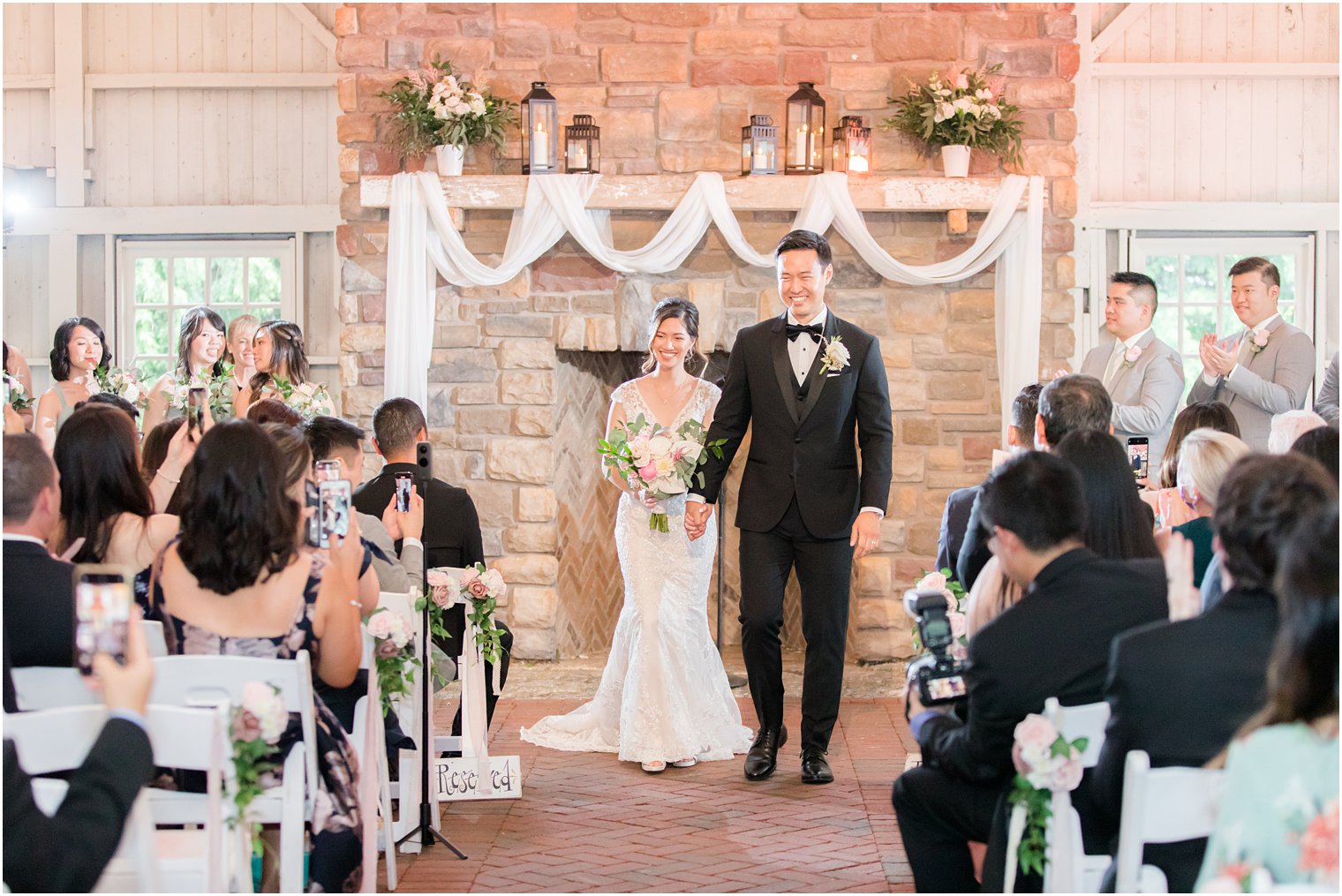 bride and groom walk down aisle after wedding ceremony in Allentown NJ