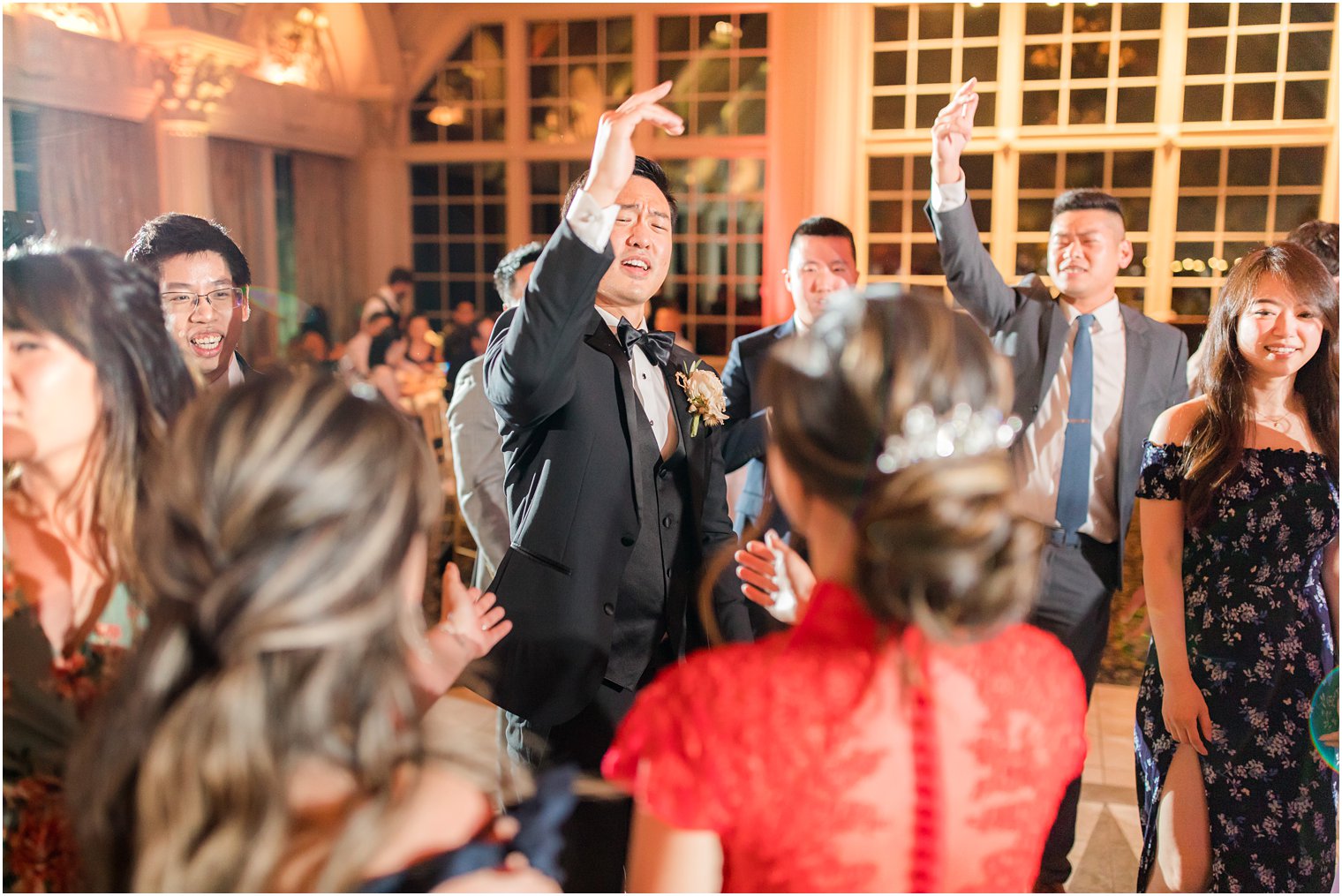 groom dances with guests during Allentown NJ wedding reception 