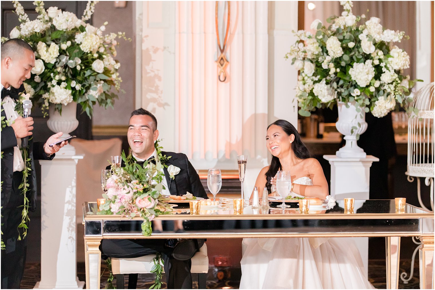 newlyweds laugh during PA wedding reception 