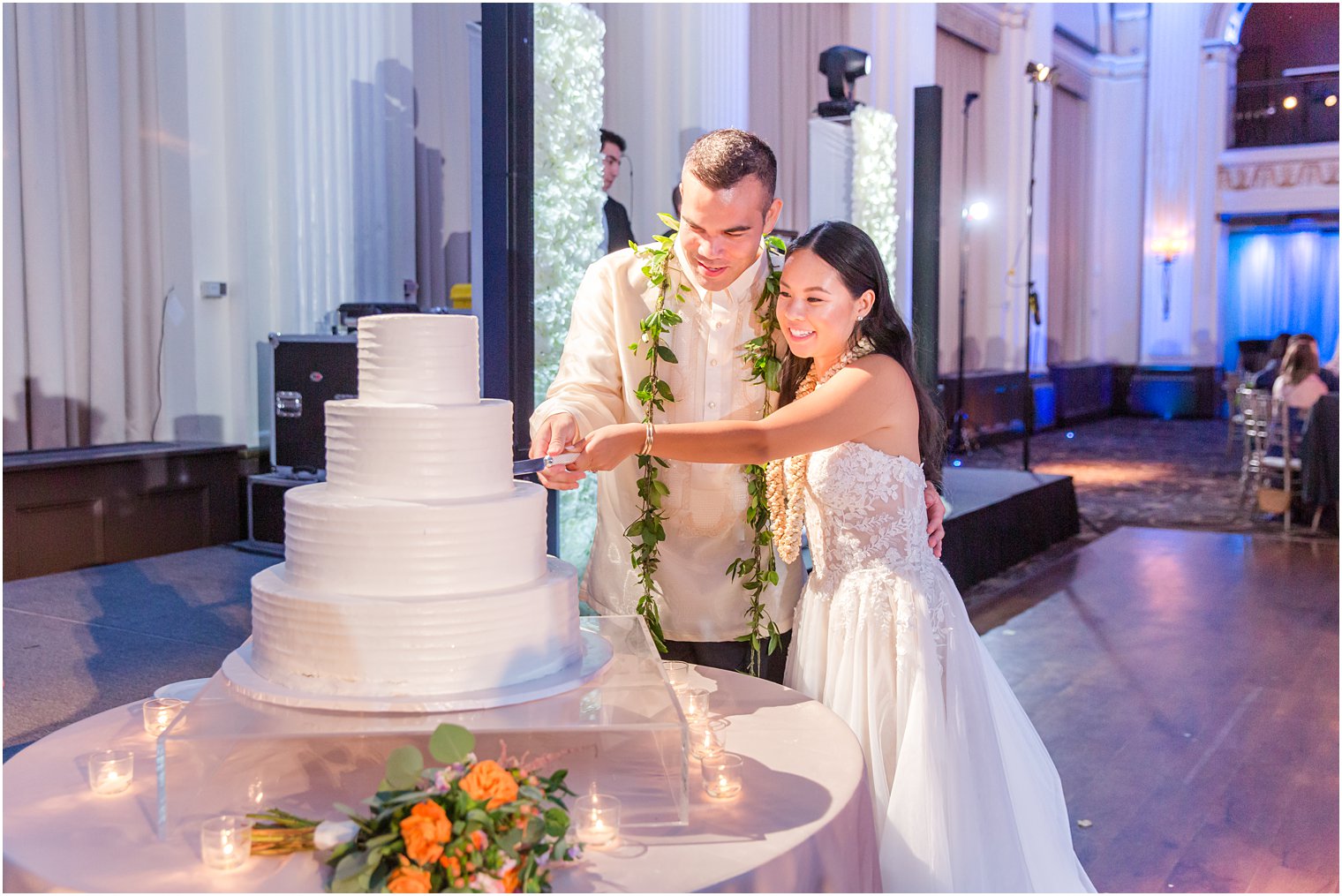 bride and groom cut wedding cake during Philly PA wedding reception