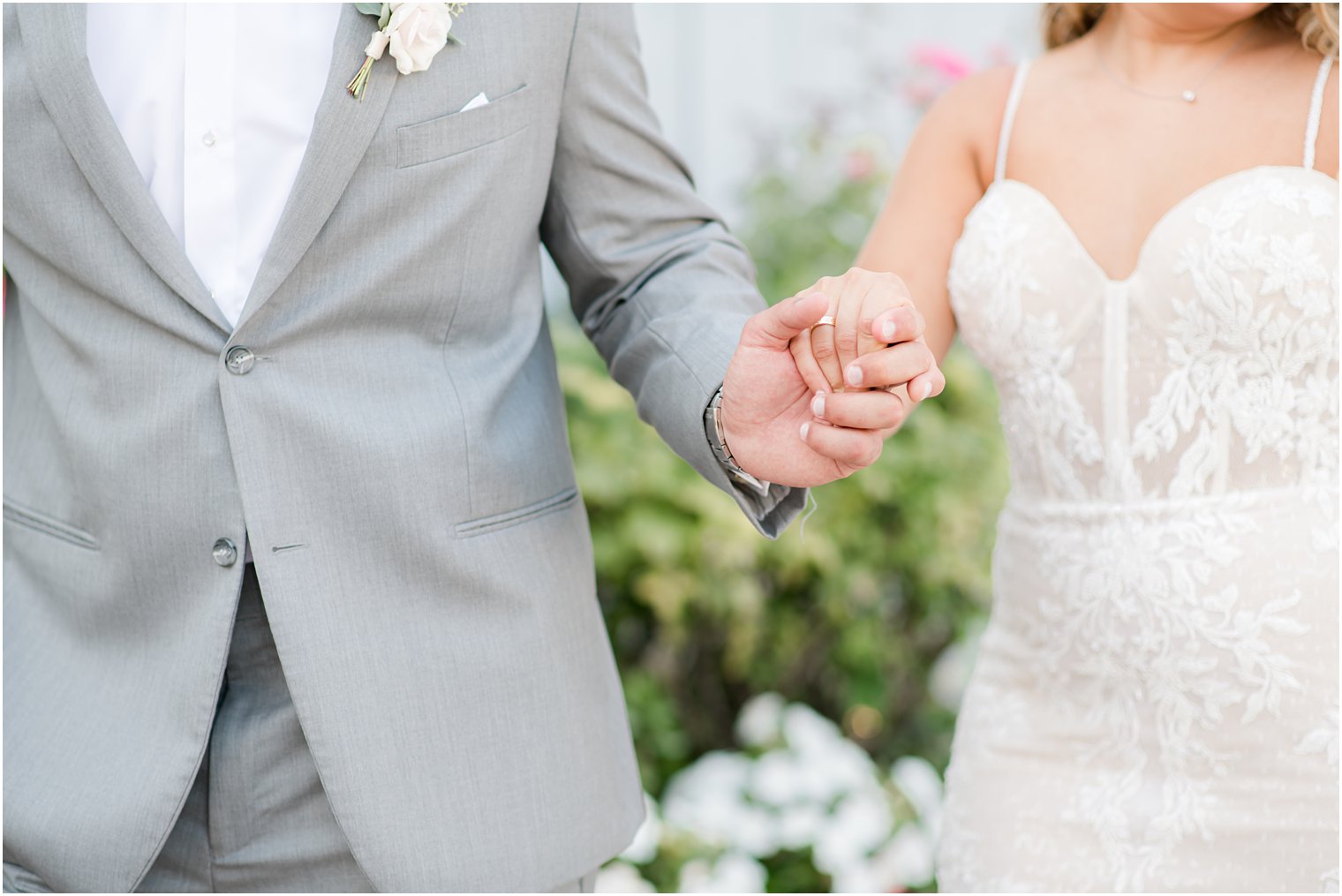 bride and groom hold hands during NJ wedding photos