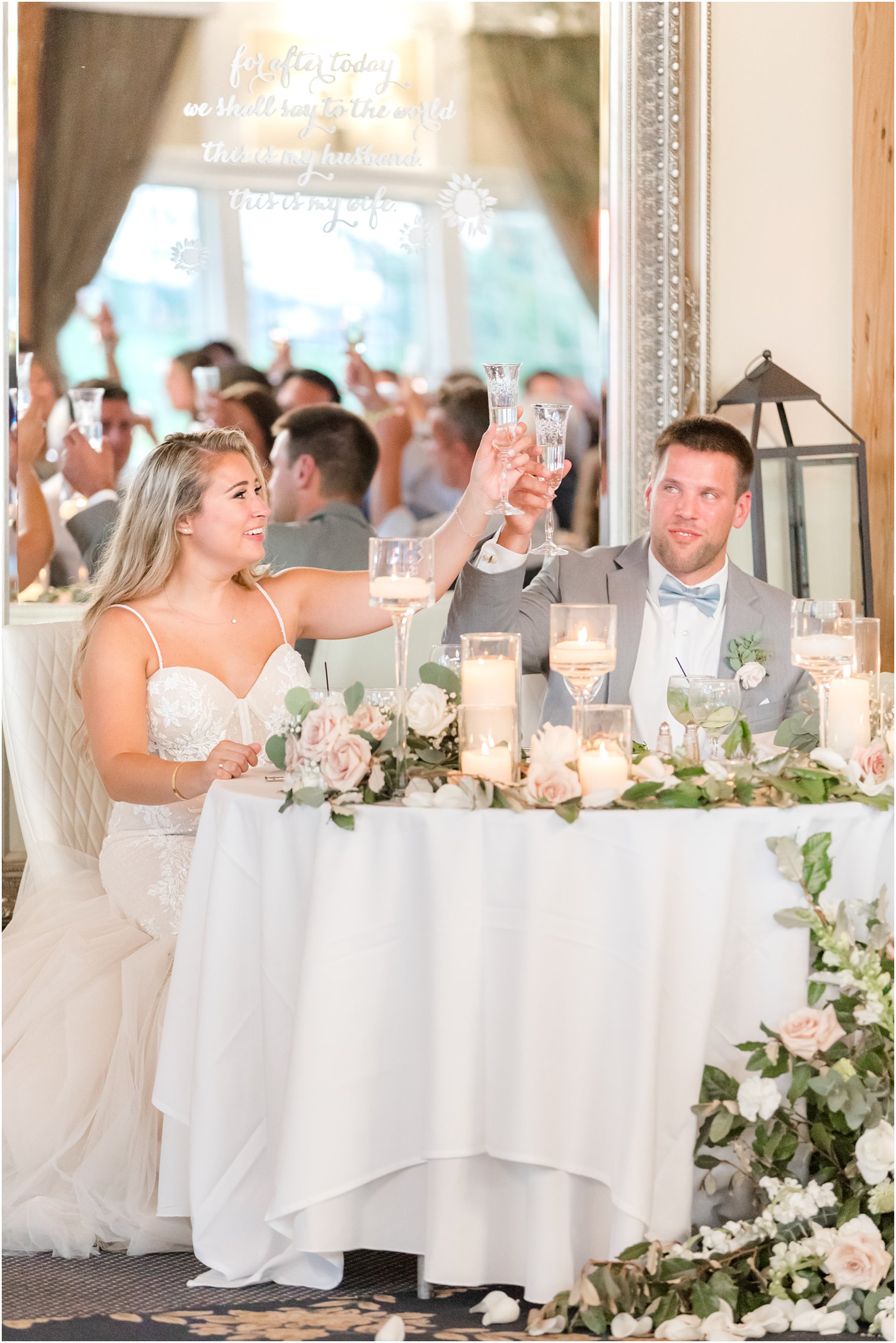 newlyweds toast champagne during toasts at Manahawkin NJ wedding reception
