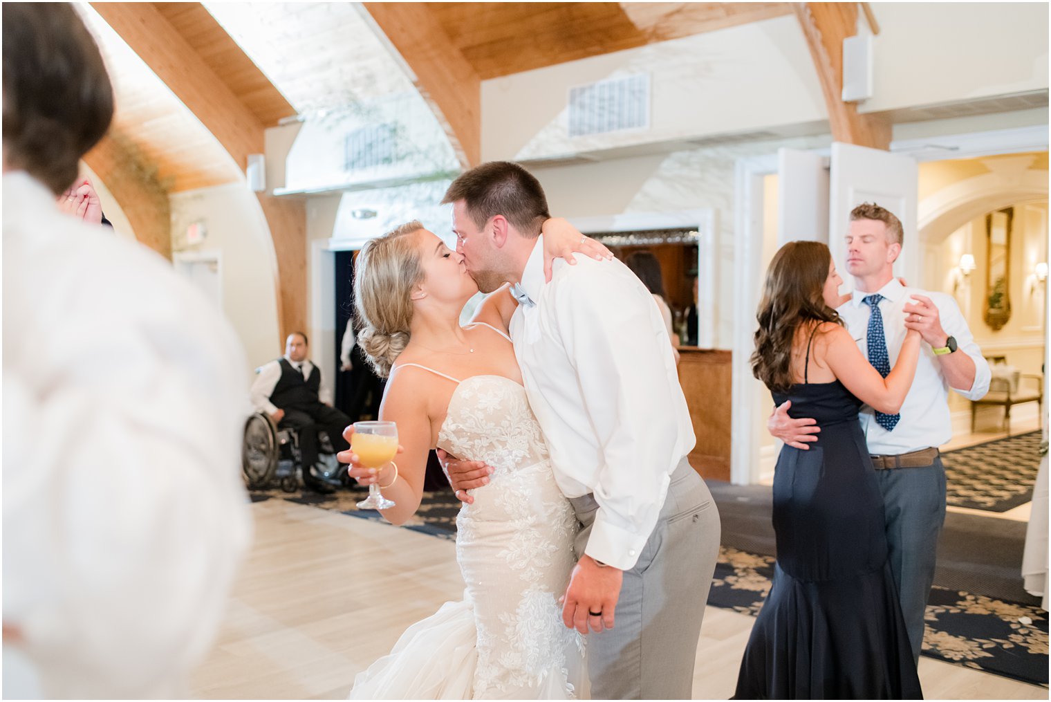 bride and groom kiss during reception at Manahawkin NJ wedding reception