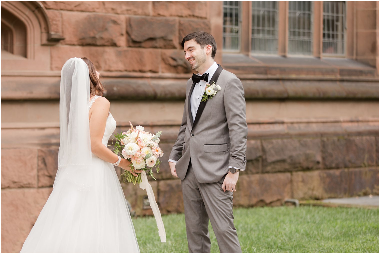 groom sees bride for the first time during first look at Princeton University