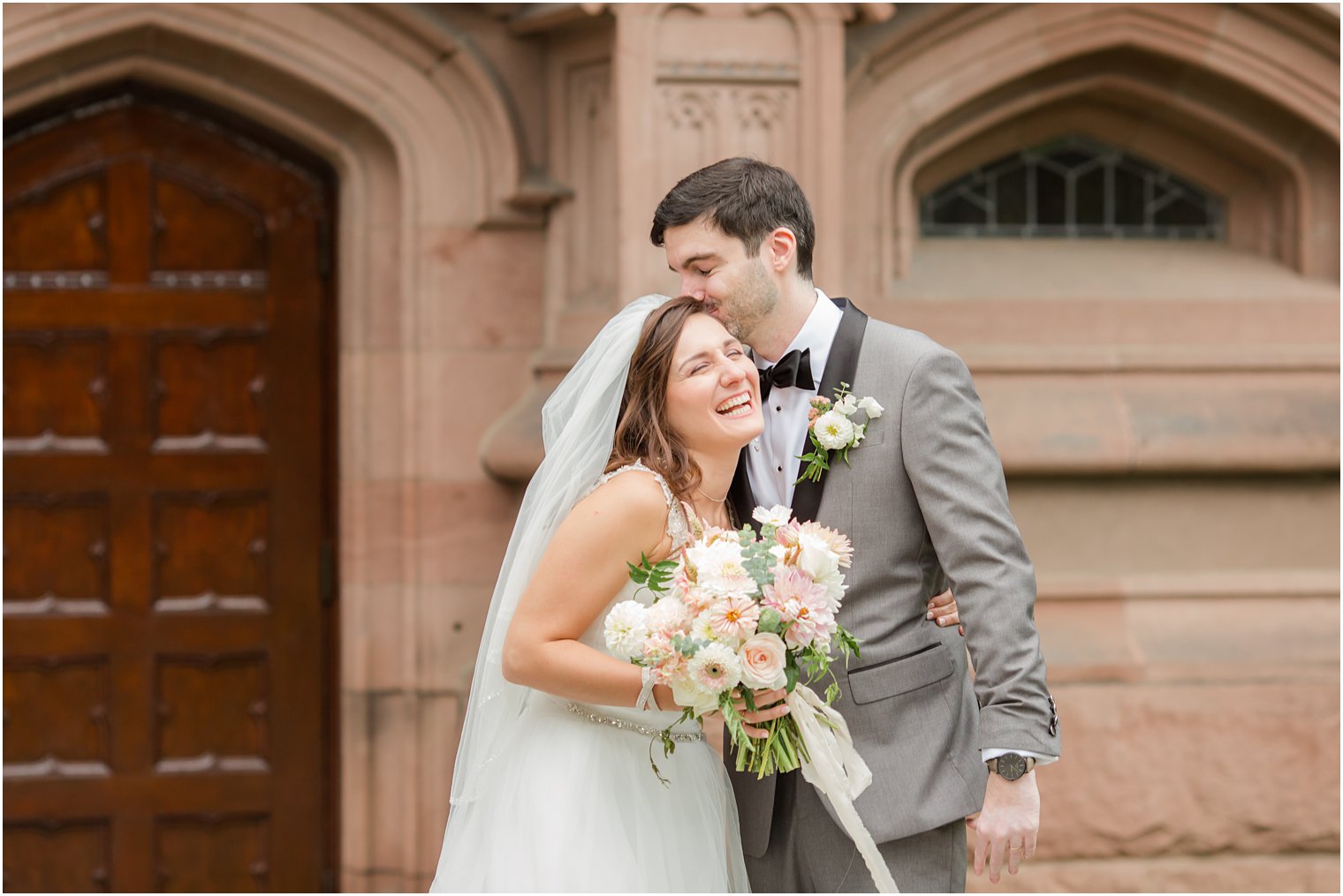 groom hugs bride during first look in Princeton NJ