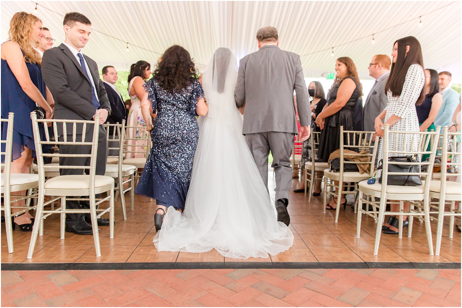 parents walk bride down the aisle at the Chauncey Hotel