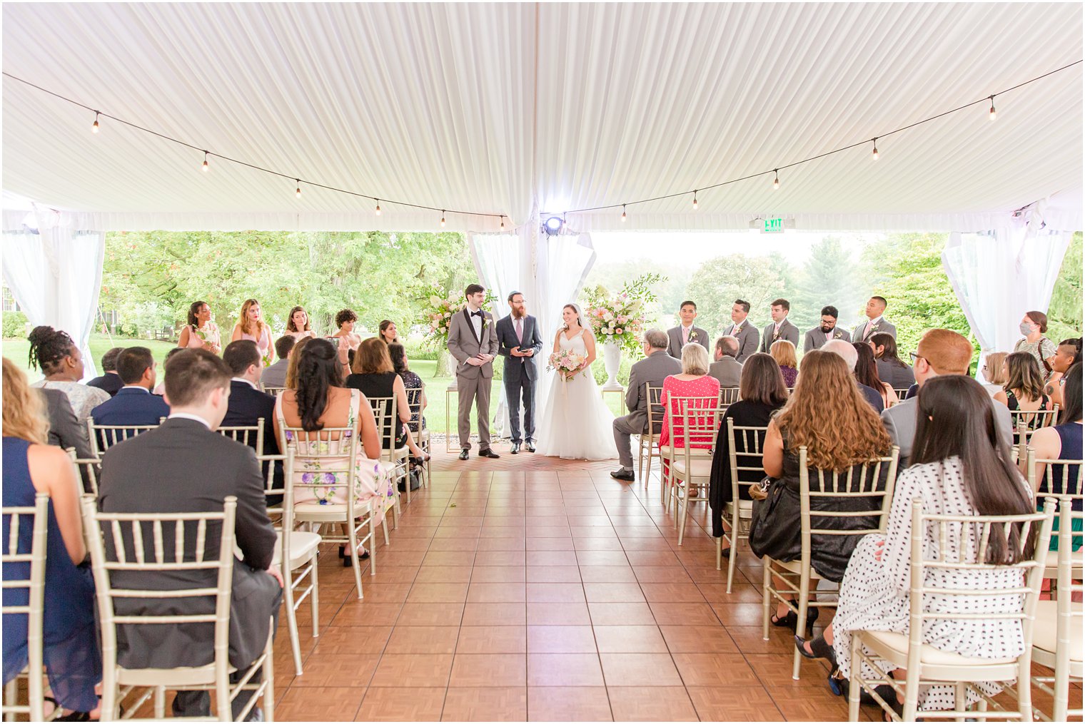 newlyweds stand together during wedding ceremony at Chauncey Hotel