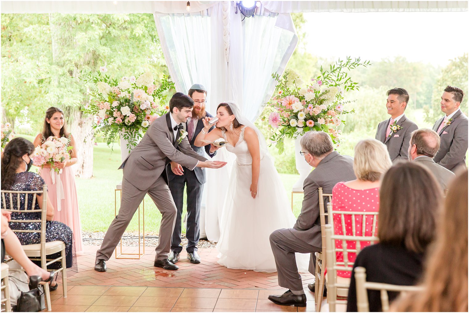 bride and groom drink during wedding ceremony at Chauncey Hotel