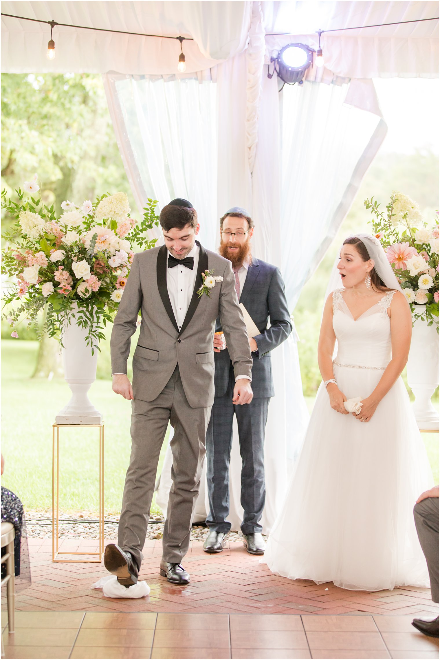 groom breaks glass during Jewish ceremony at Chauncey Hotel