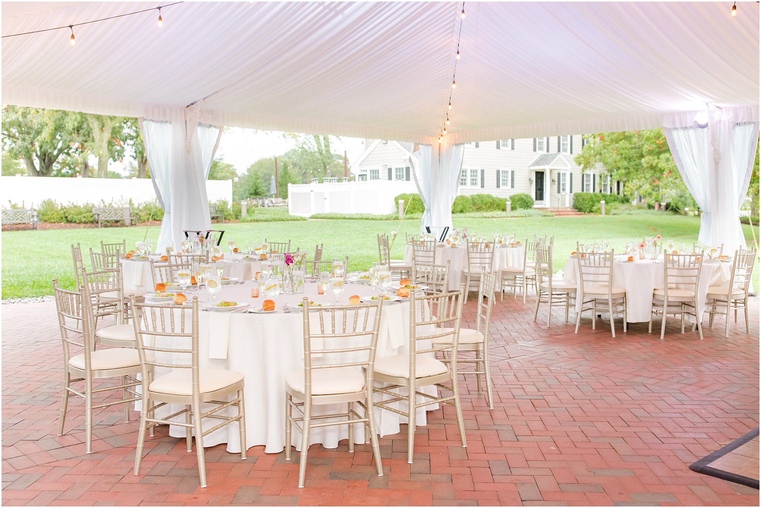 white and gold details for tented NJ wedding reception