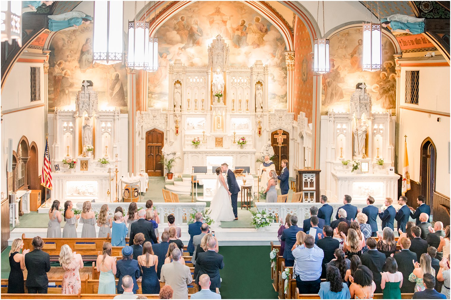 newlyweds kiss after traditional church wedding in NJ