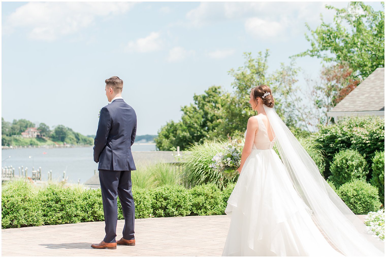 bride approaches groom for first look at Crystal Point Yacht Club