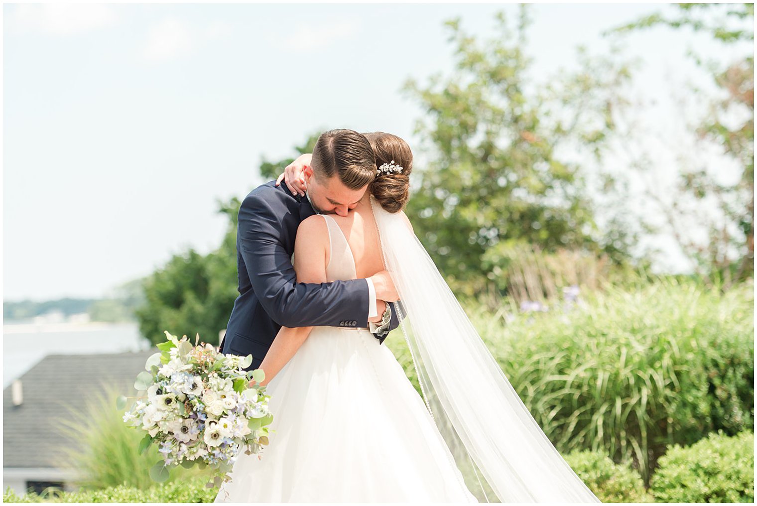 groom hugs bride during first look in Point Pleasant NJ