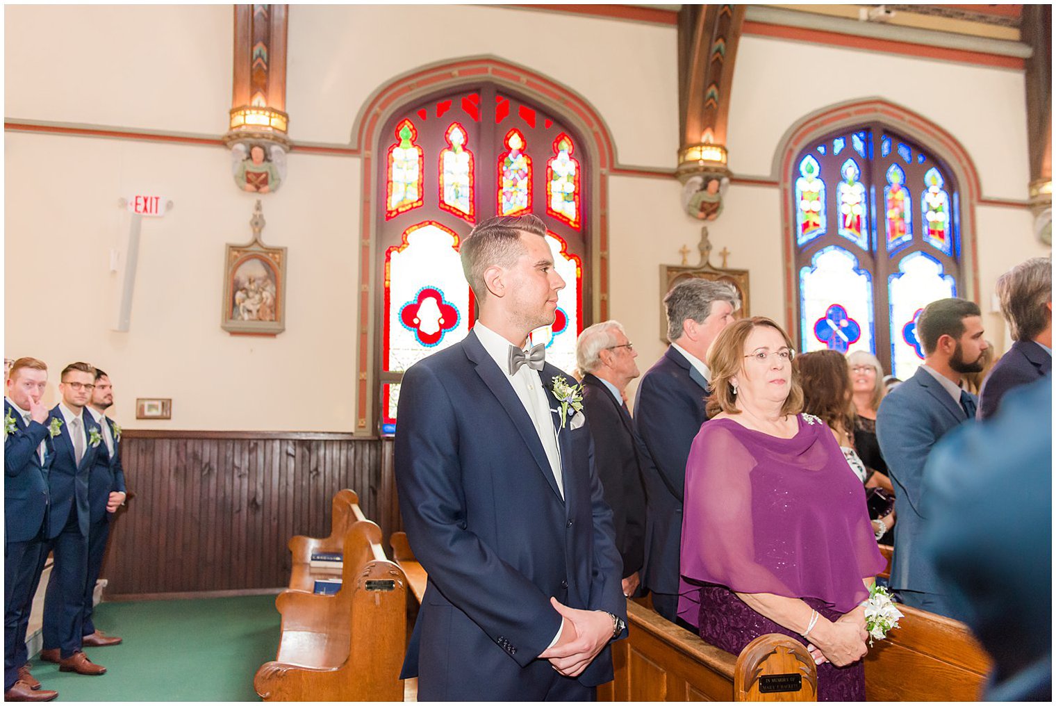 groom waits for bride at altar during traditional church wedding in NJ