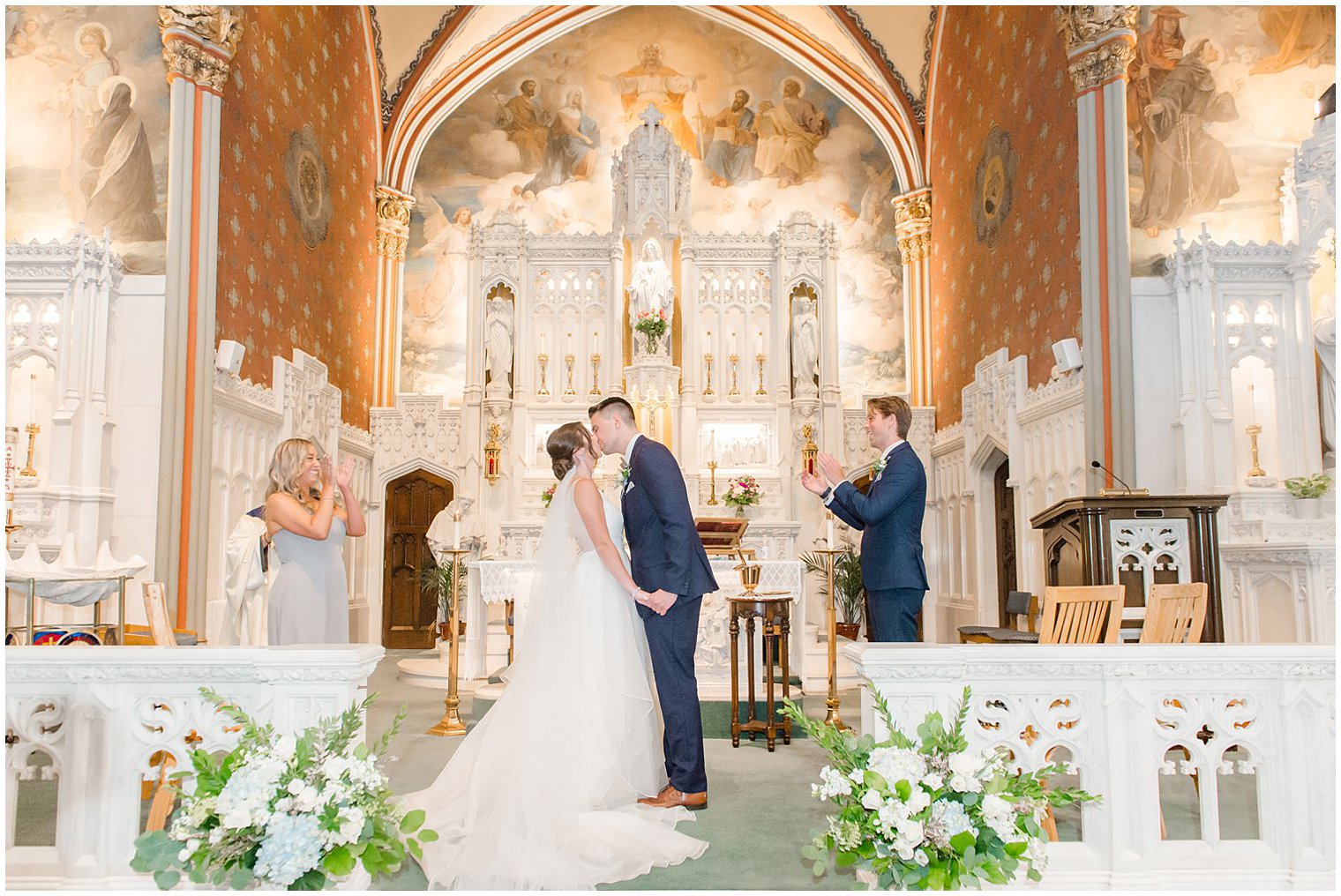 bride and groom kiss during traditional church wedding in NJ
