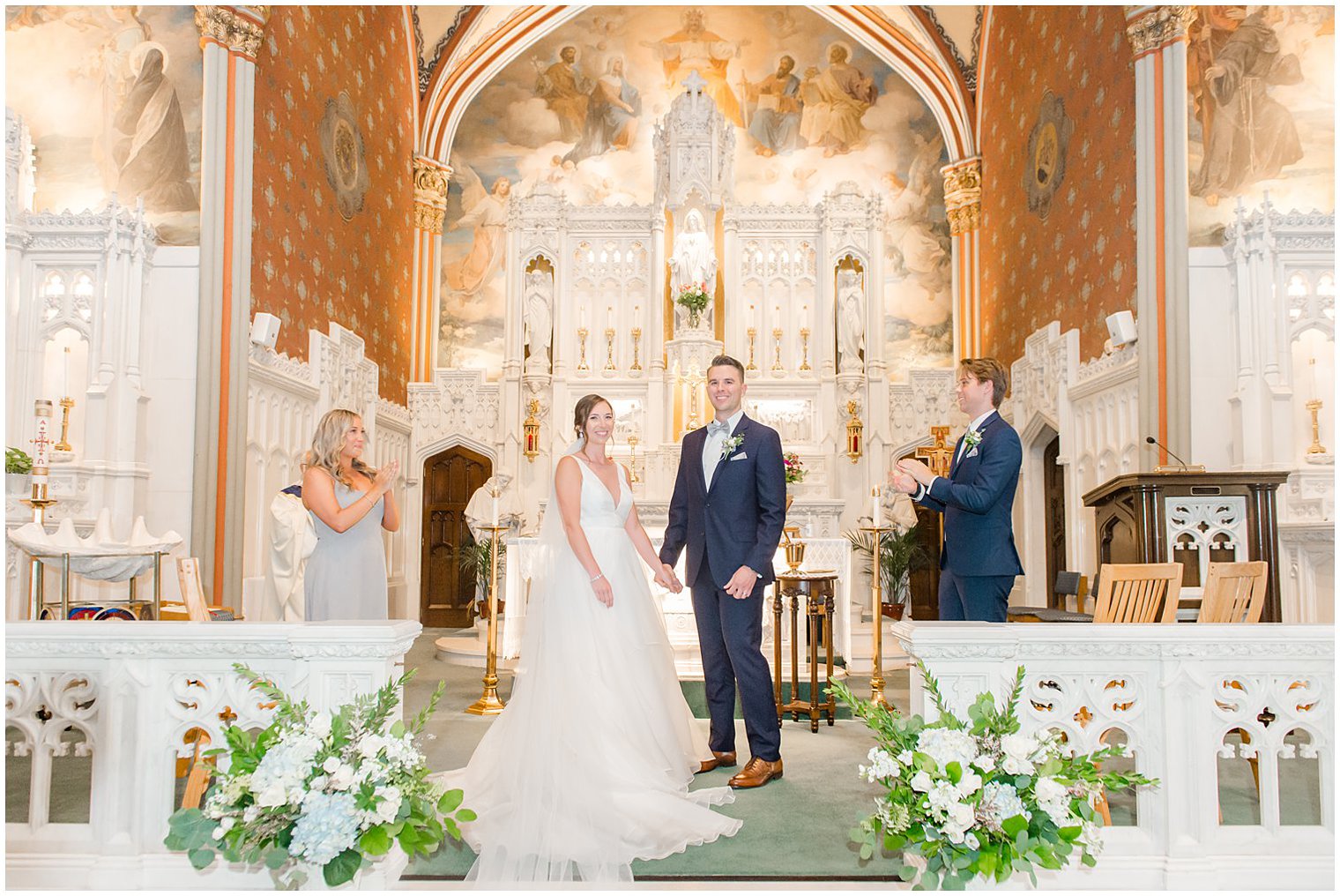 newlyweds look at guests after first kiss in church