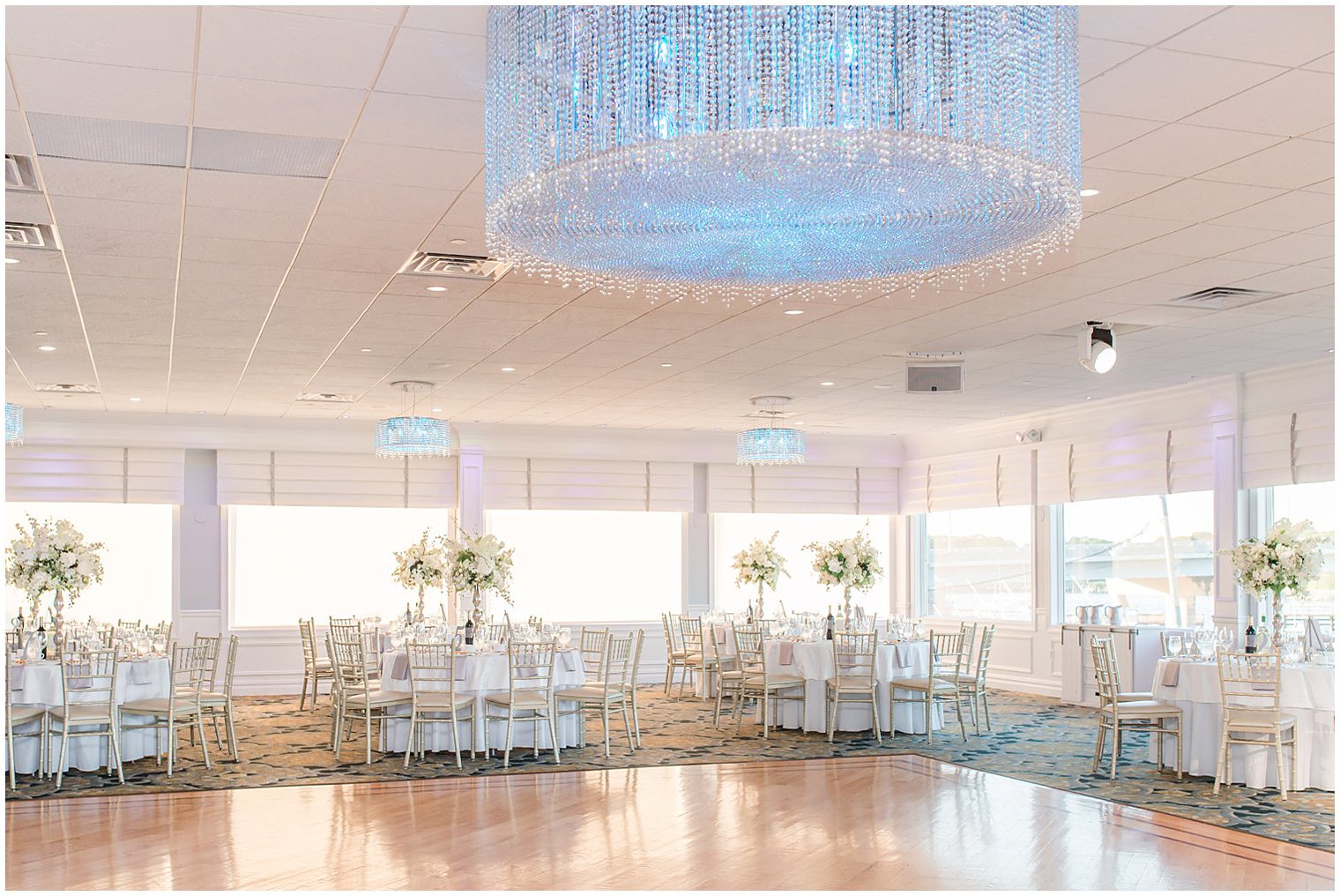 reception in Point Pleasant NJ table seating with tall floral centerpieces 